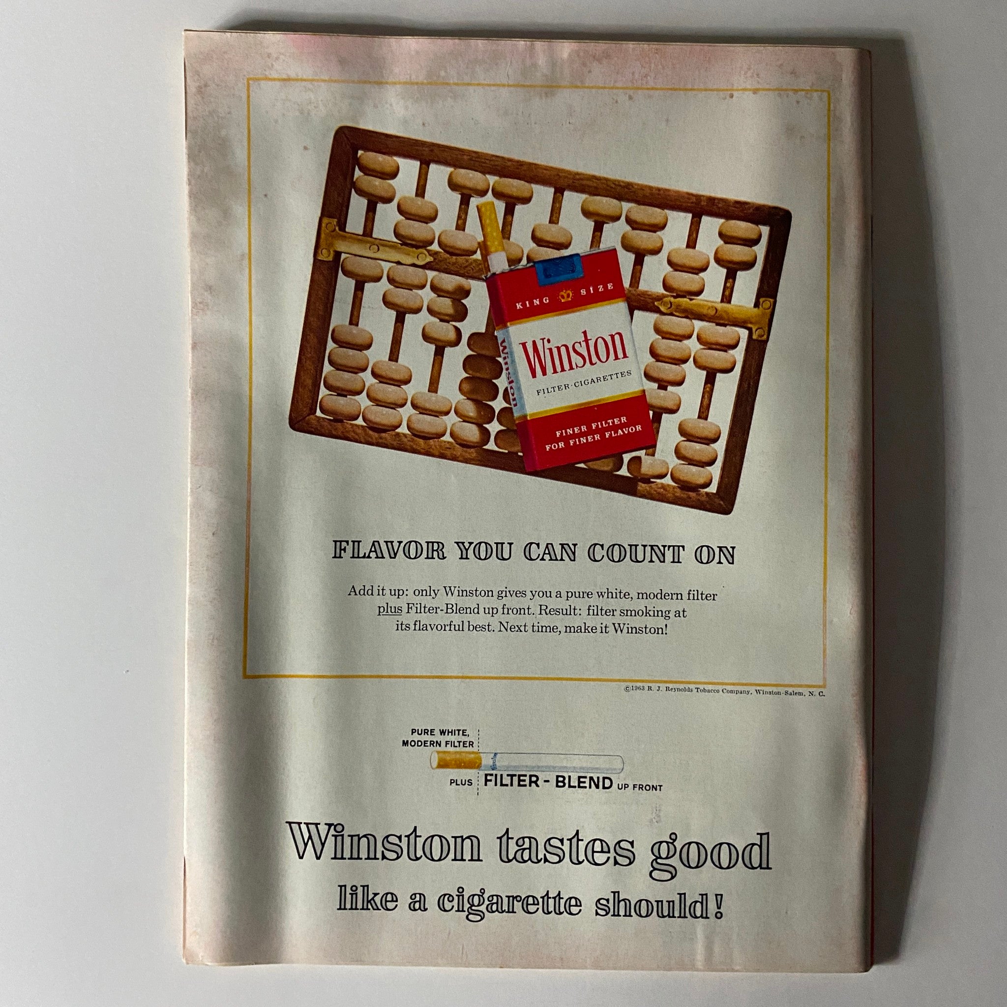 Vintage advertisement for Winston cigarettes in Time Magazine November 15, 1963, promoting the brand's modern filter and flavor, reflecting the advertising style of the era.