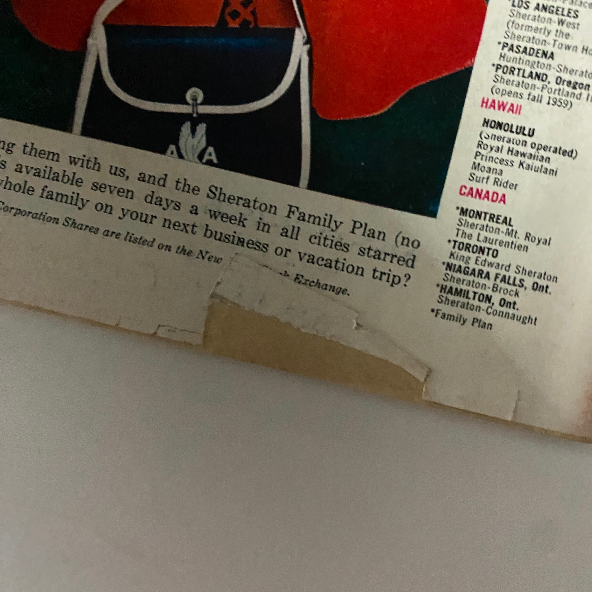 Close-up of Sheraton Hotels advertisement, detailing family plan information and various hotel locations, promoting travel and leisure options.