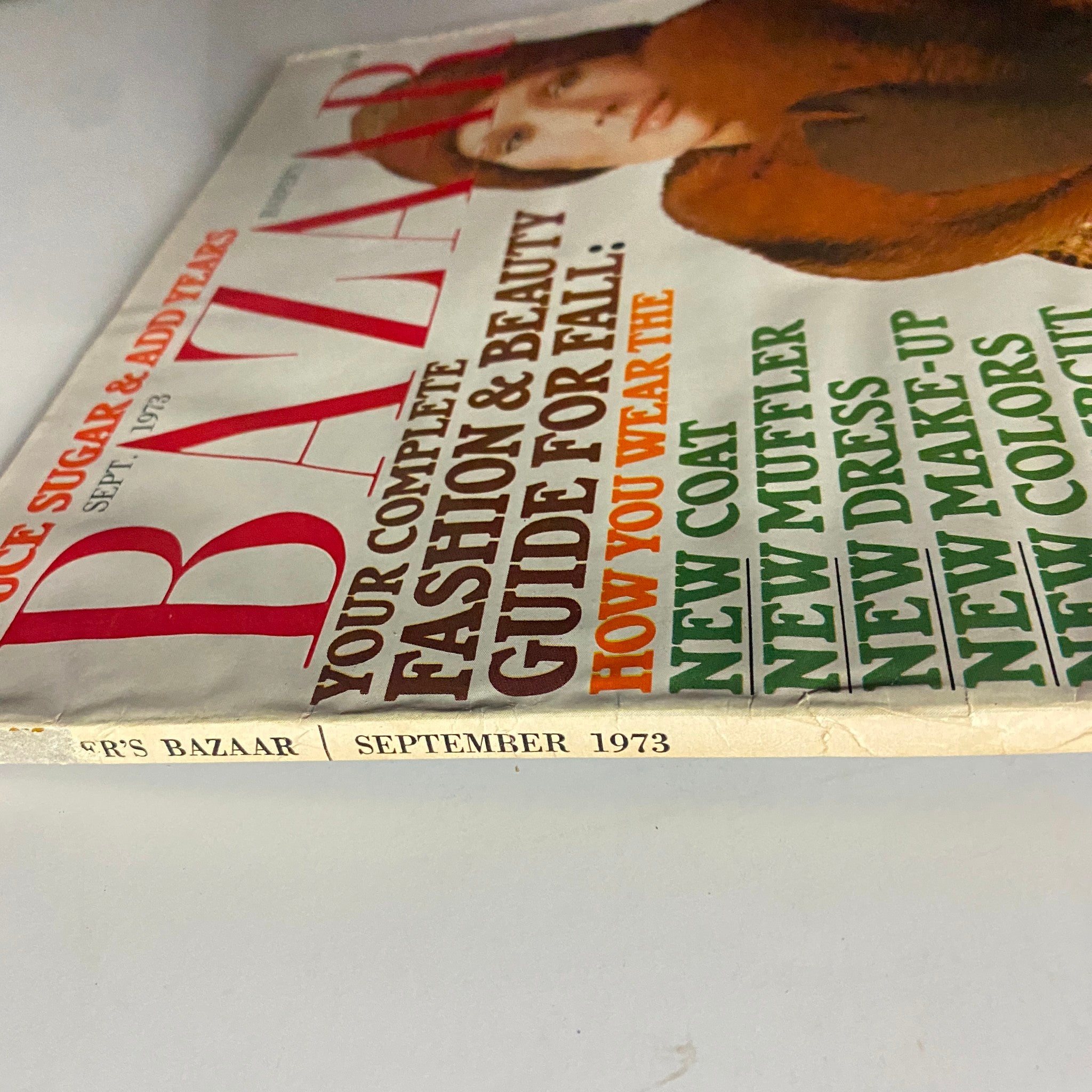 Close-up image of the spine and cover of Harper's Bazaar Magazine September 1973, emphasizing vintage typography and the edition's relevance to fashion enthusiasts.
