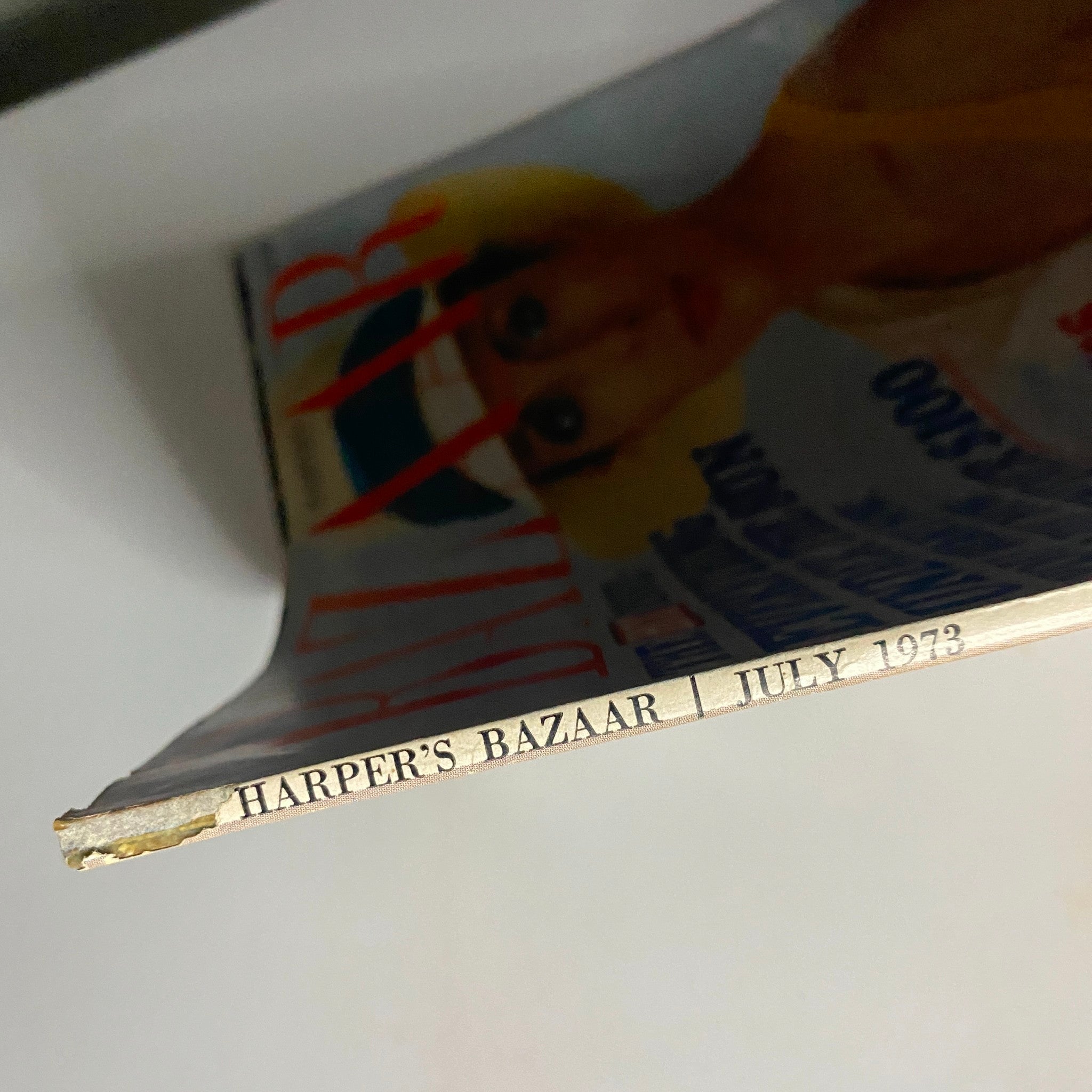 Spine of Harper's Bazaar Magazine July 1973 displaying the title and month, showcasing the vintage style of this collectible issue.