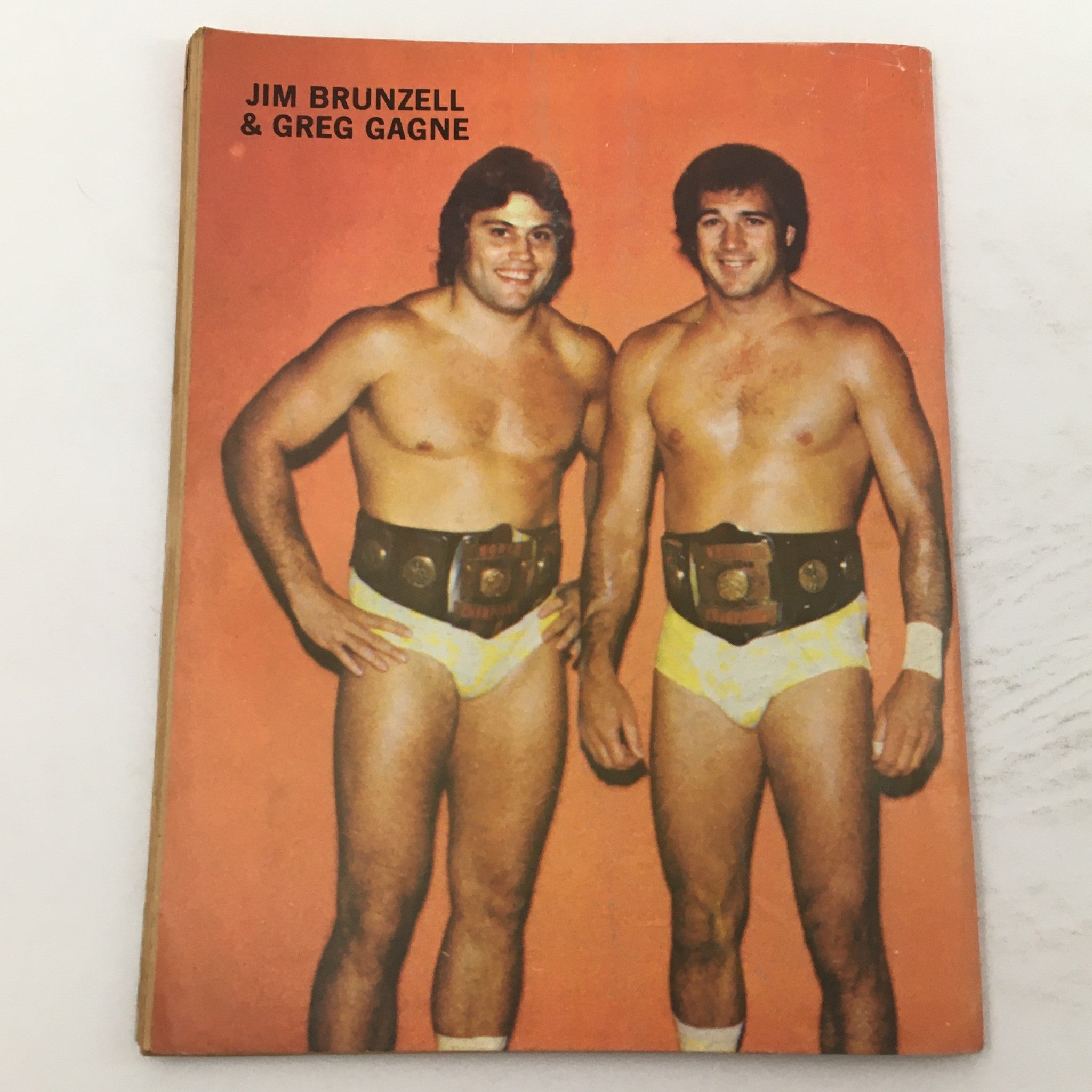 Wrestling Magazine #75 1981 image of Jim Brunzell and Greg Gagne posing with their championship belts.