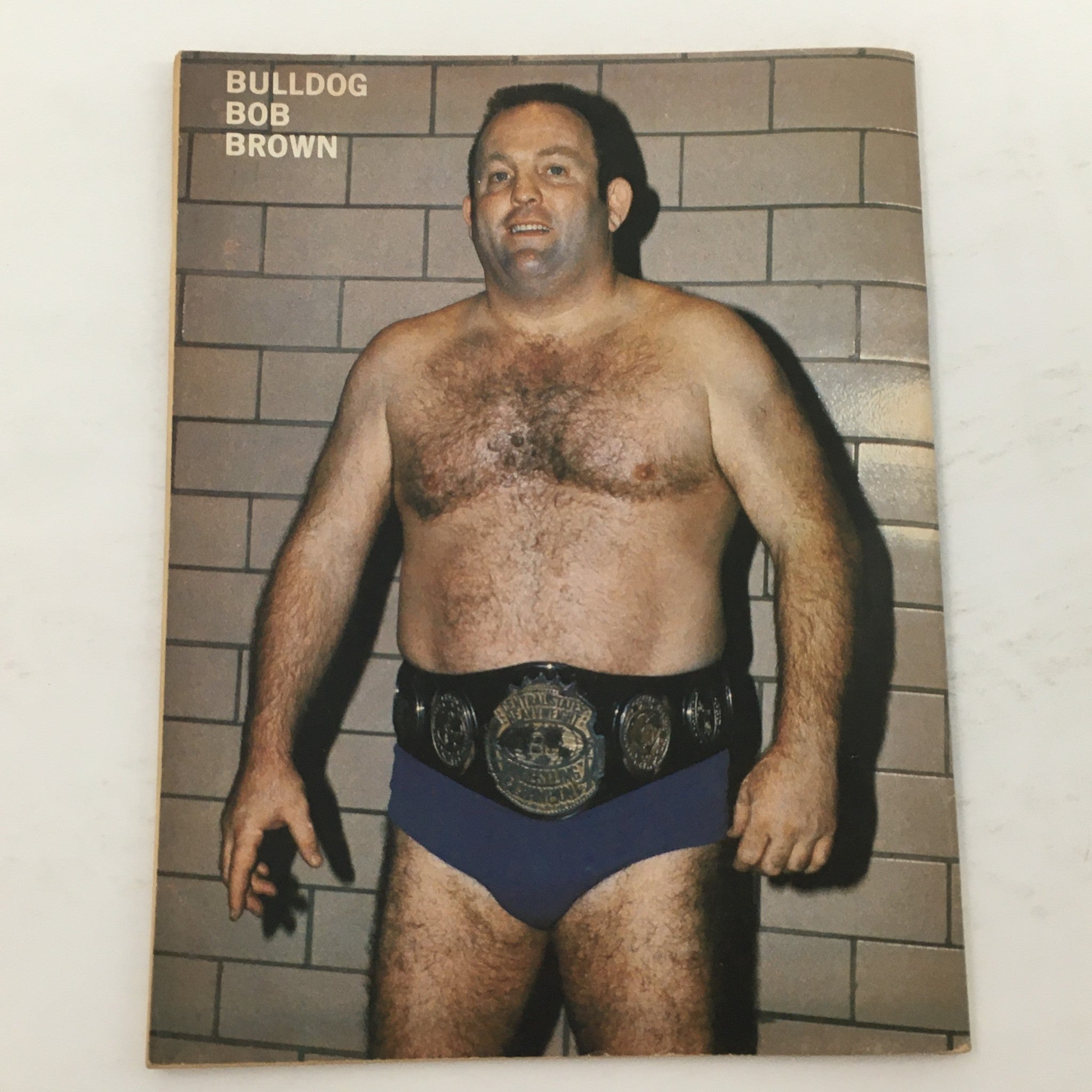 Photo of Bulldog Bob Brown, featured in The Ring's Wrestling Magazine, April 1981, showcasing his wrestling championship belt.