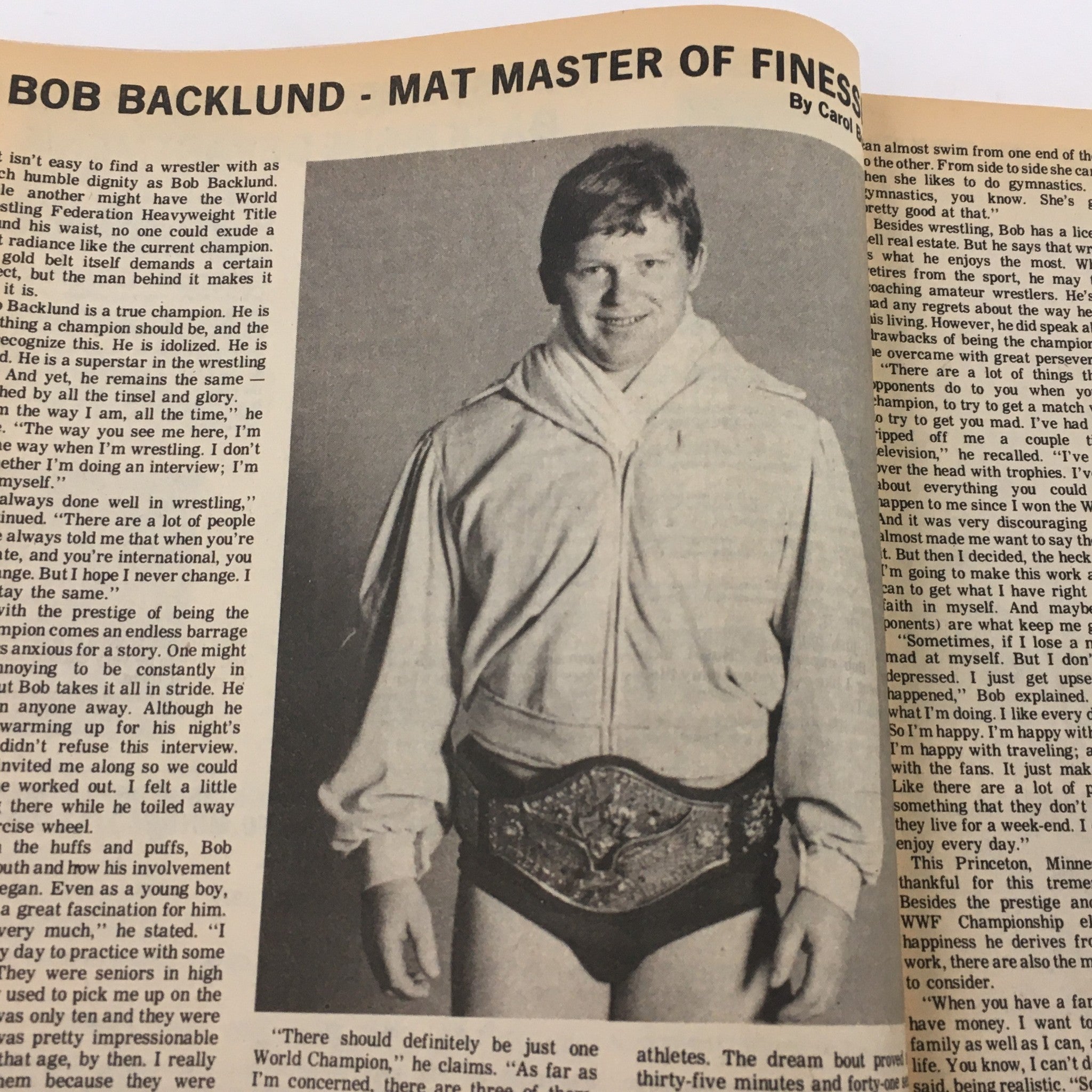 Bob Backlund, featured in The Ring's Wrestling Magazine April 1981, dressed in a white robe and holding a wrestling championship belt, showcasing his role as 'Mat Master of Finesse.'
