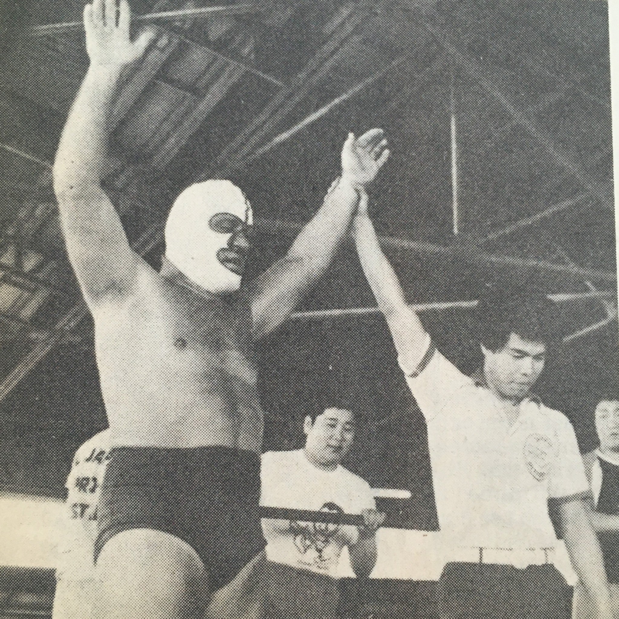 Vintage photograph from The Ring's Wrestling Magazine December 1980 showing a masked wrestler celebrating a victory.