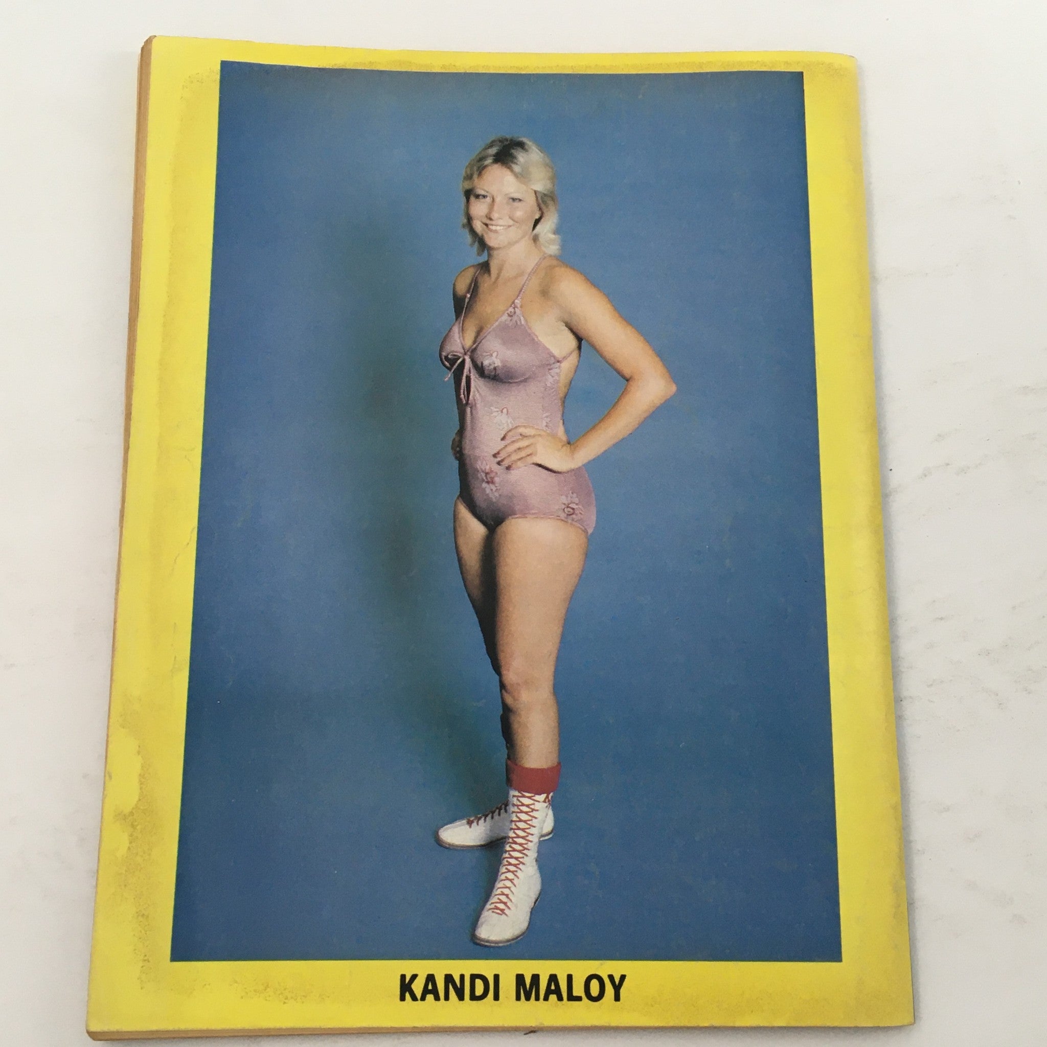 Portrait of Kandi Maloy from The Ring's Wrestling Magazine August 1981 issue #74, displaying her in a classic wrestling outfit.