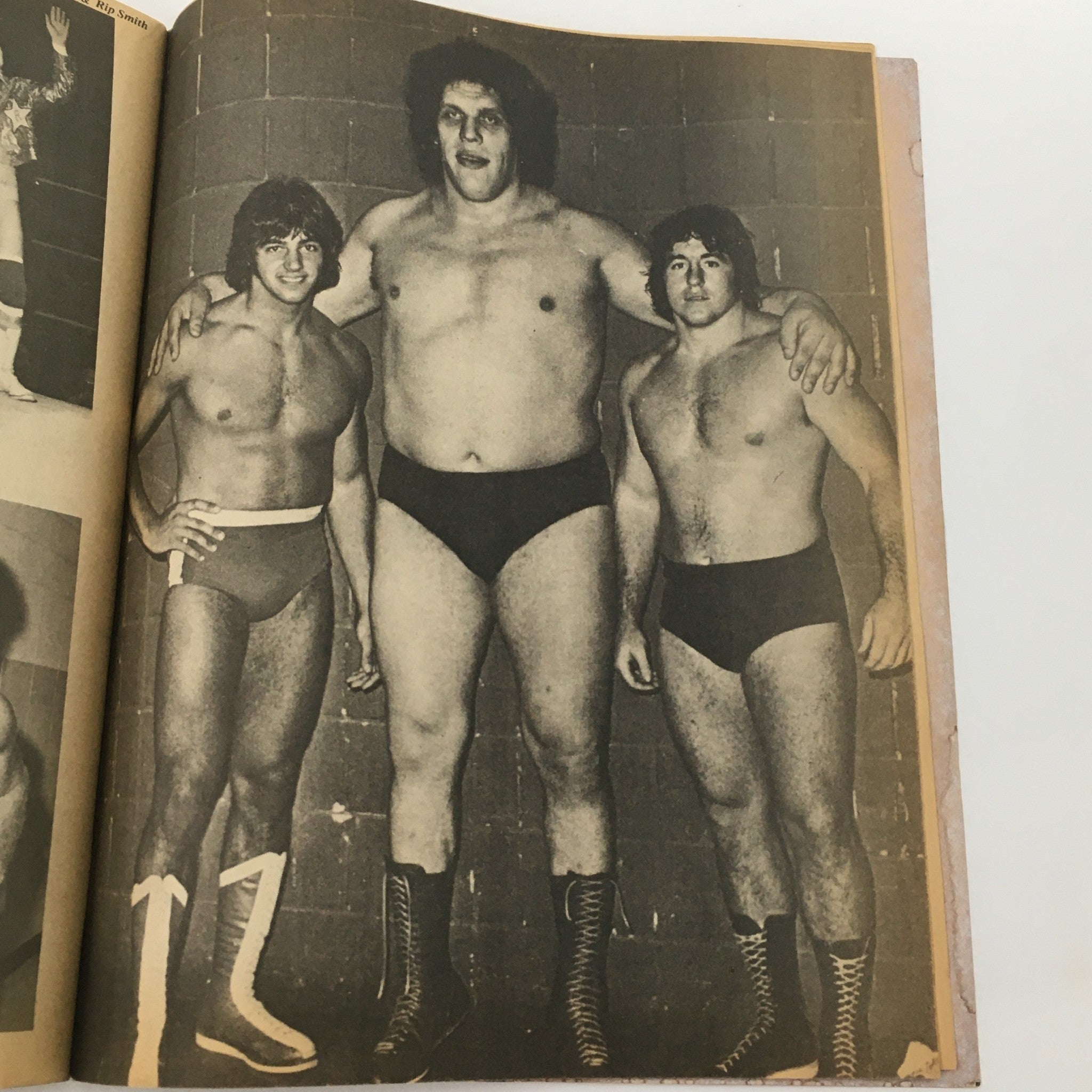 Wrestling Magazine September 1980 showcasing a grouping of iconic wrestlers including Andre The Giant, illustrating a moment of camaraderie in the wrestling world.