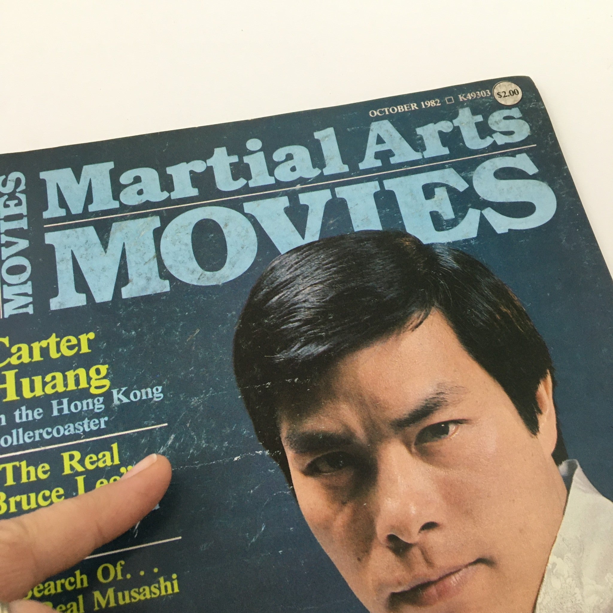Detailed view of the top left corner of Martial Arts Movies Magazine October 1982 cover, showcasing the title and promotional text about its featured articles.