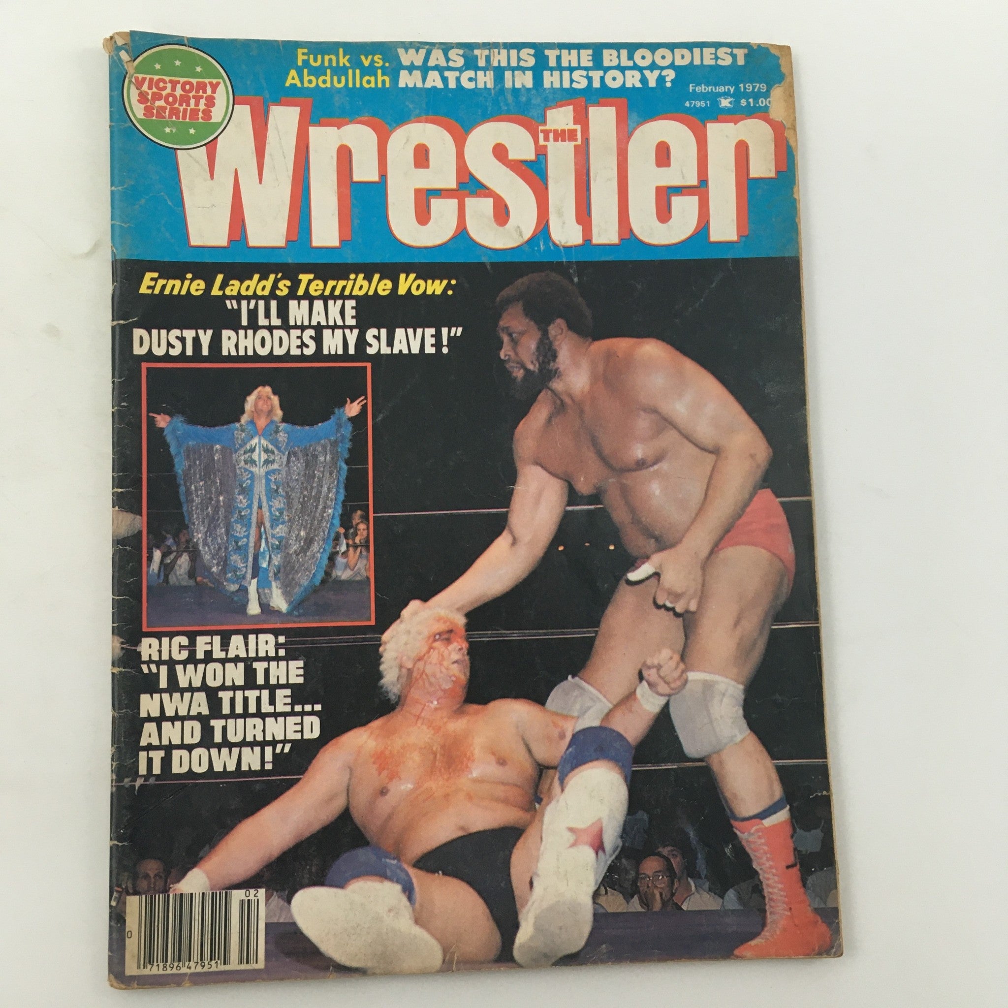 The Wrestler Magazine February 1979 cover featuring iconic wrestlers, including Ernie Ladd and Ric Flair in action. The magazine showcases a headline about Dusty Rhodes and includes commentary on significant wrestling events. A must-have collectible for wrestling fans and memorabilia collectors.