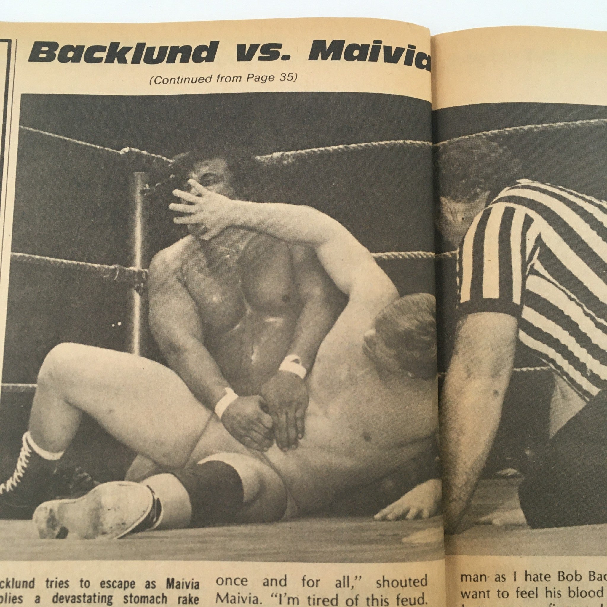 Inside Wrestling Magazine April 1979 page displaying a wrestling match between Bob Backlund and Peter Maivia, capturing a moment of action in professional wrestling.