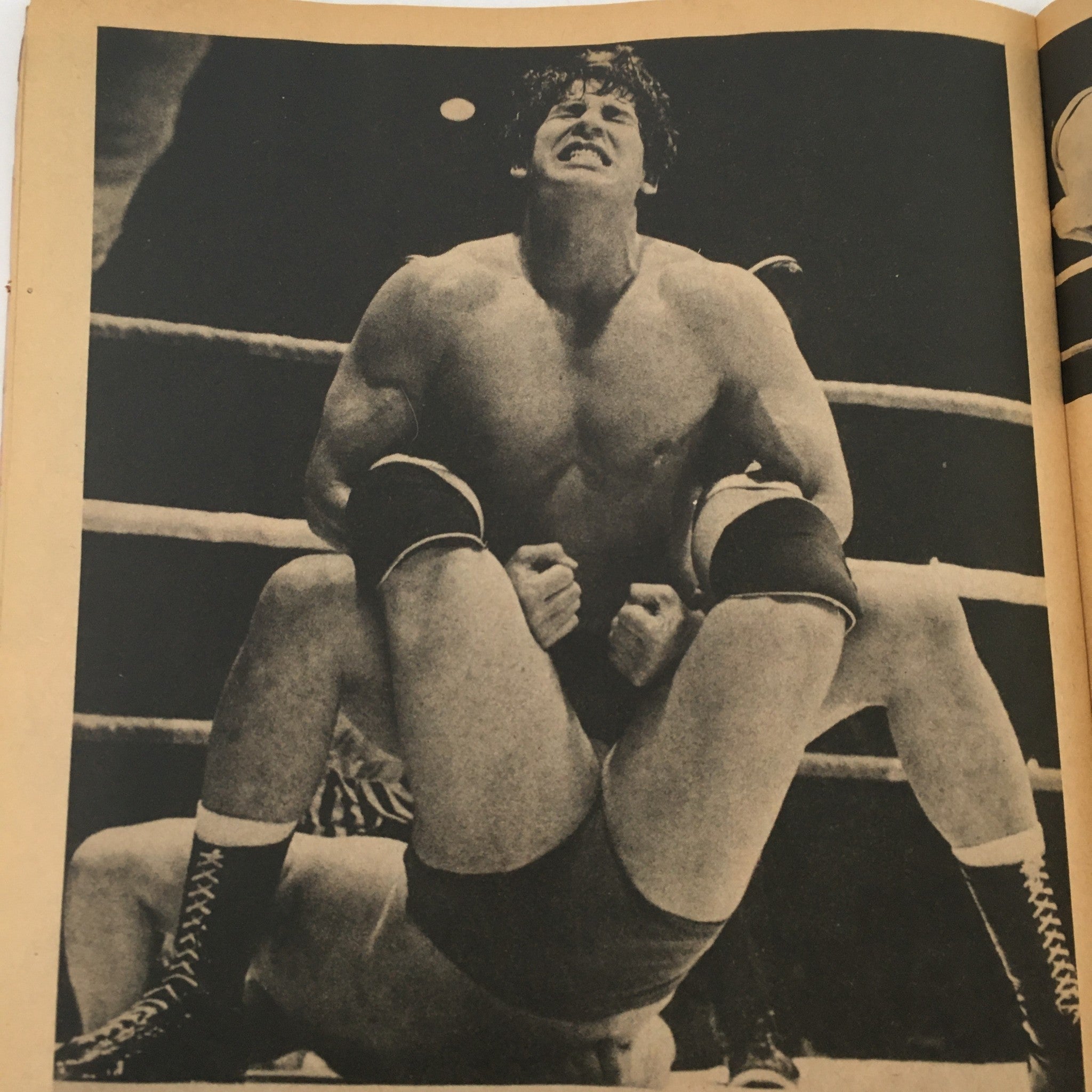 Inside Wrestling Magazine November 1981 featuring a wrestling match action shot, showcasing a contestant in a muscular pose, demonstrating strength during a hold.