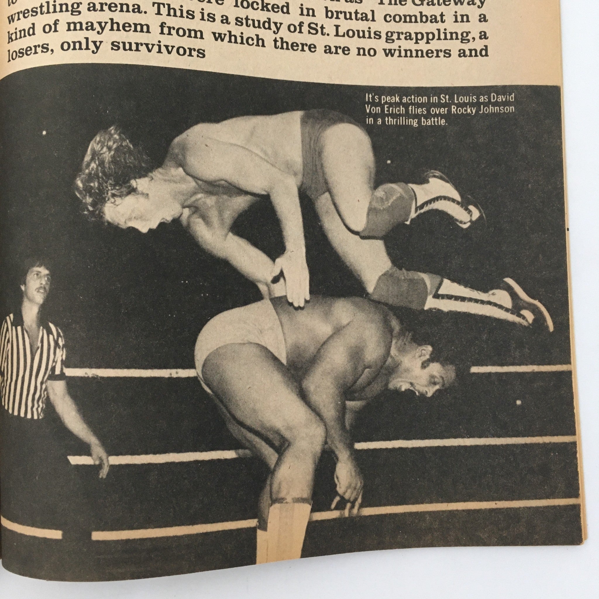 Action shot from Inside Wrestling Magazine December 1981 depicting David Von Erich flying over Rocky Johnson in a wrestling match.