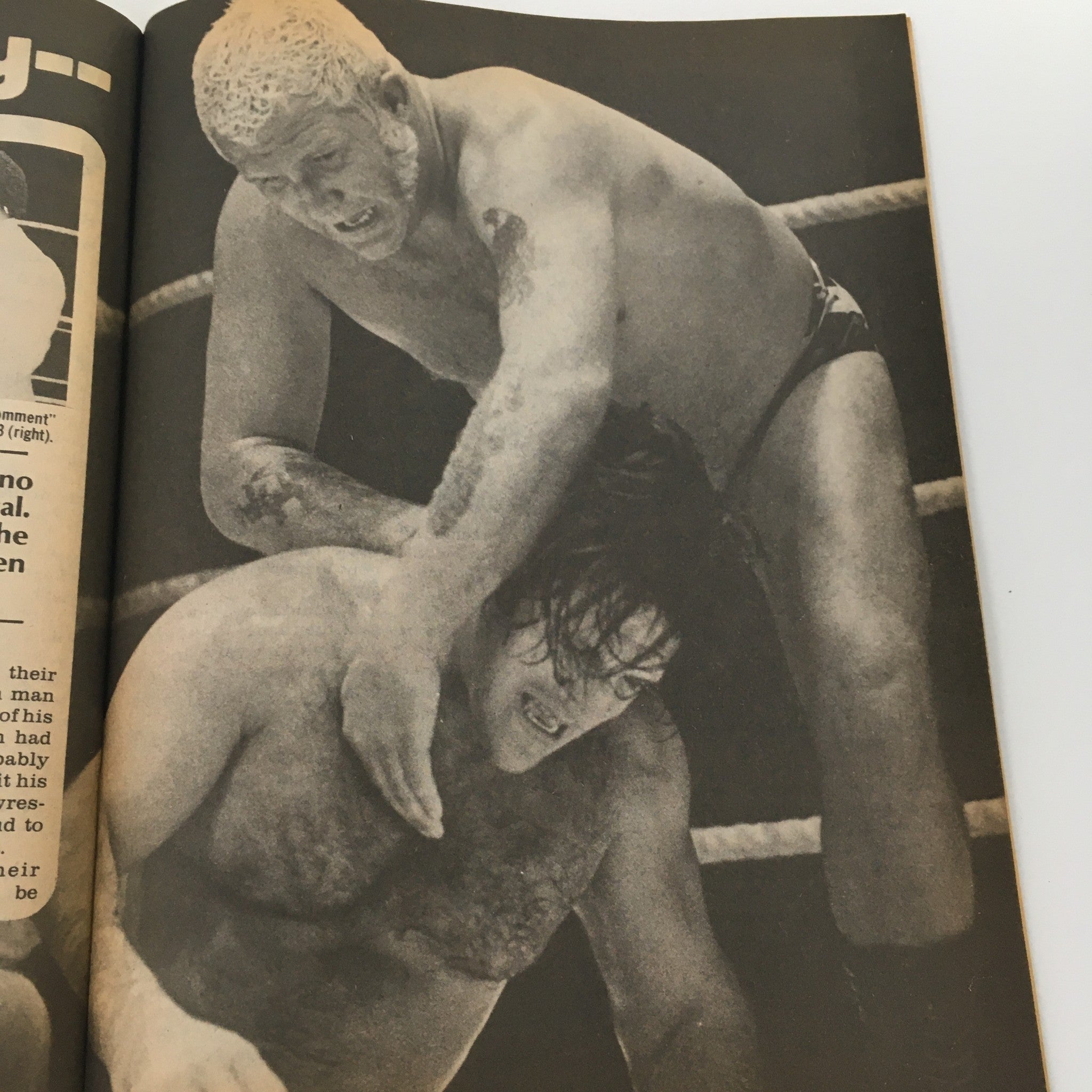 Another page from the Sports Review Wrestling Magazine January 1981, showcasing a dynamic wrestling scene with two wrestlers engaged in a competitive match.