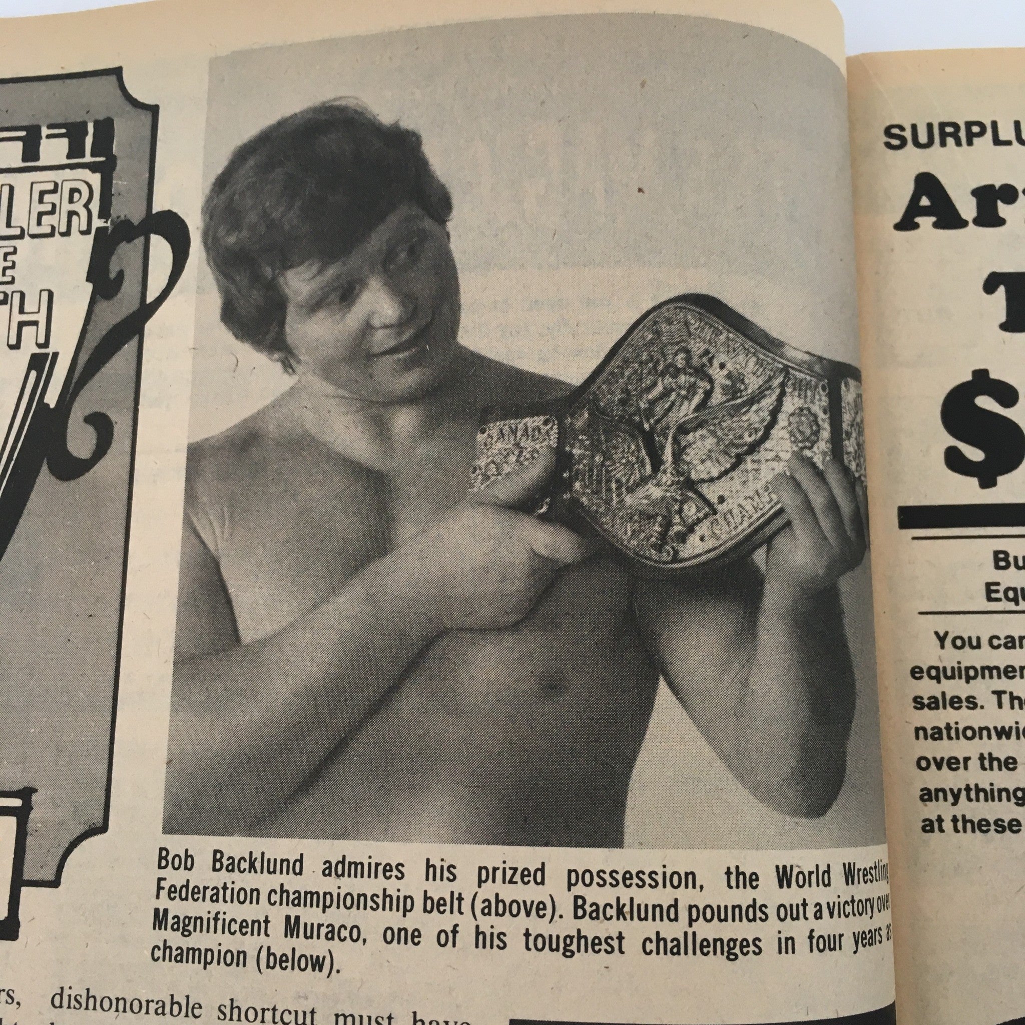 Sports Review Wrestling Magazine May 1982 displaying Bob Backlund admiring his World Wrestling Federation championship belt, highlighting his prestigious victory in the wrestling world.