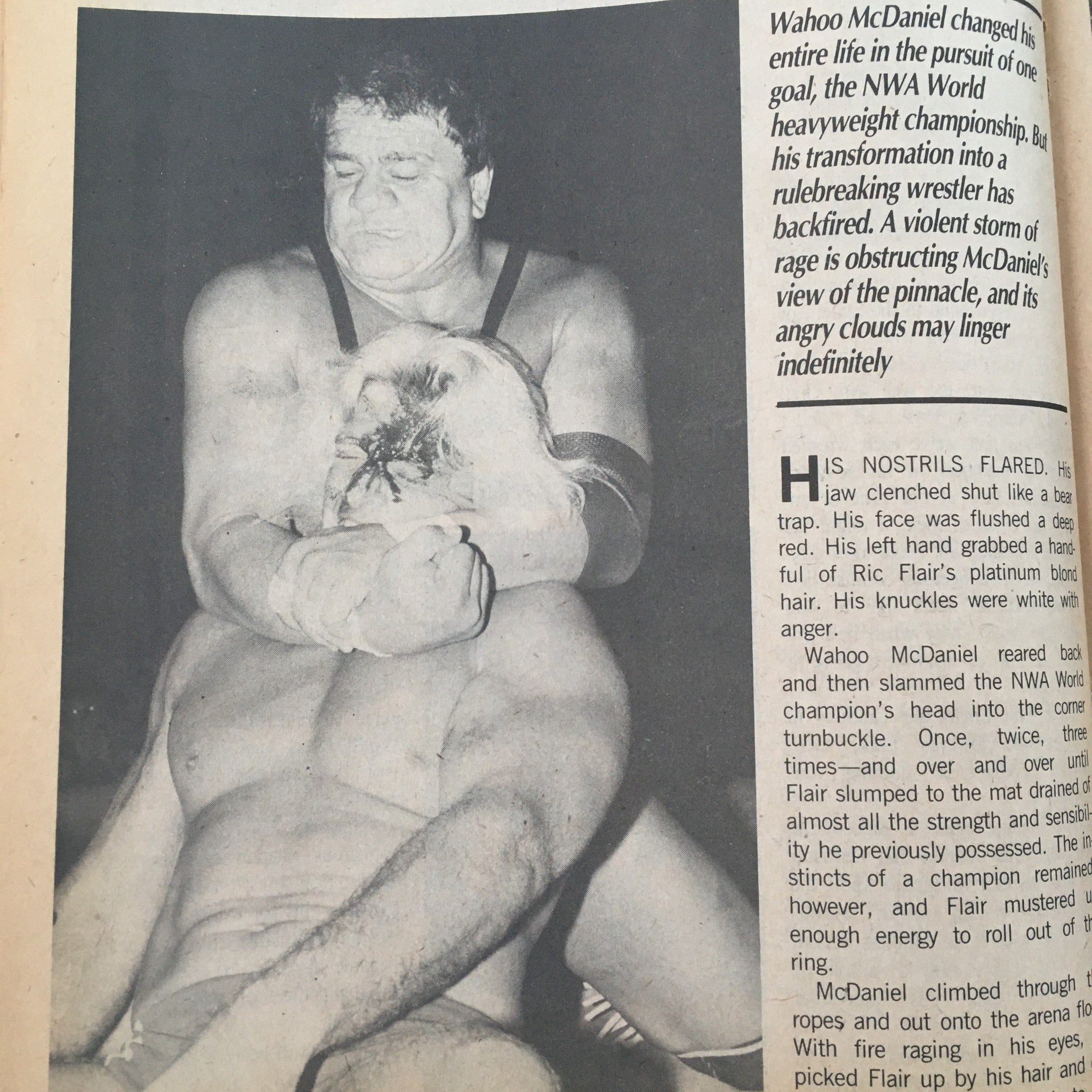 Action shot of Wahoo McDaniel grappling with Ric Flair in Sports Review Wrestling Magazine January 1985, highlighting a pivotal moment in their rivalry.