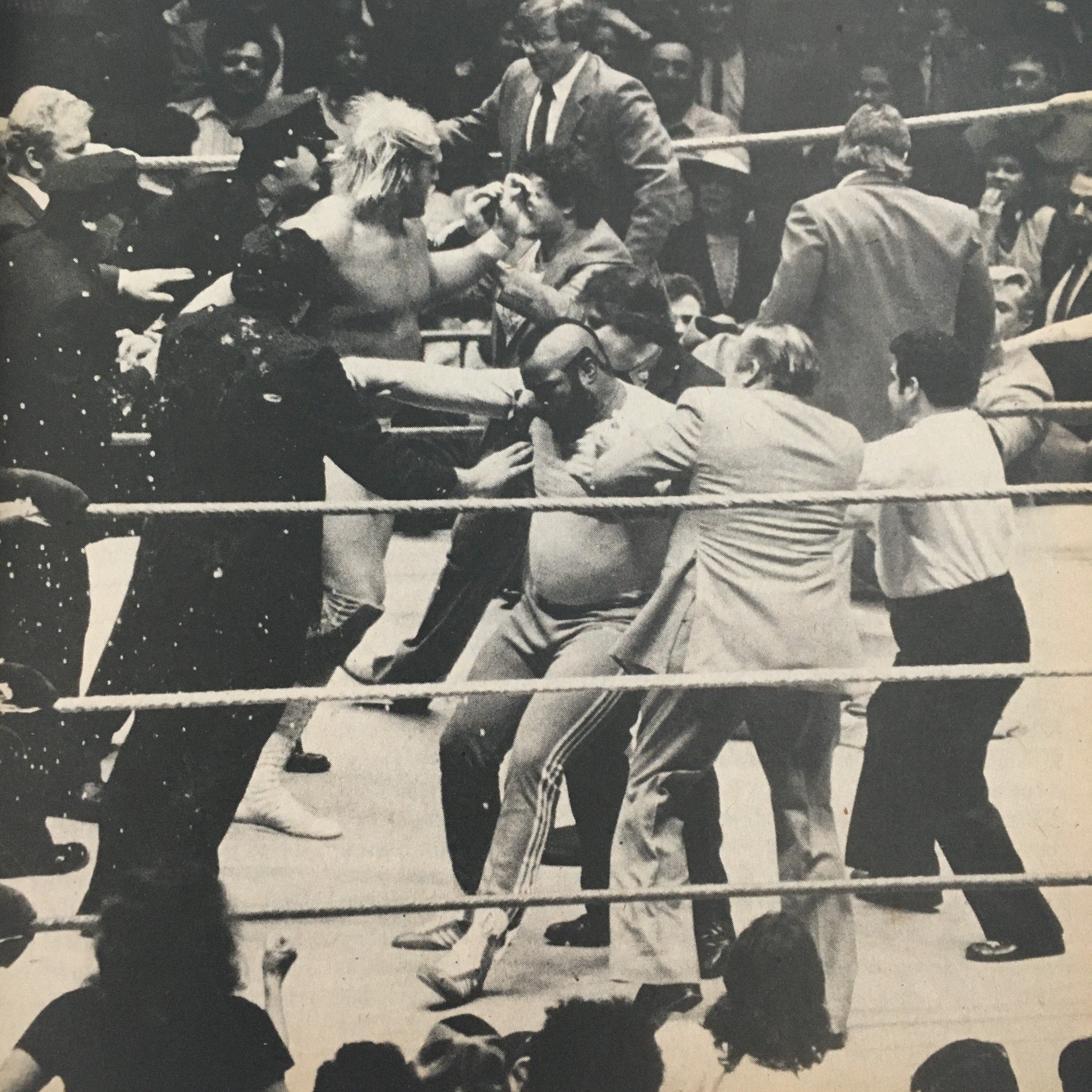 Black and white photograph from Pro Wrestling Illustrated Magazine July 1985, capturing an intense wrestling match with multiple participants in the ring.