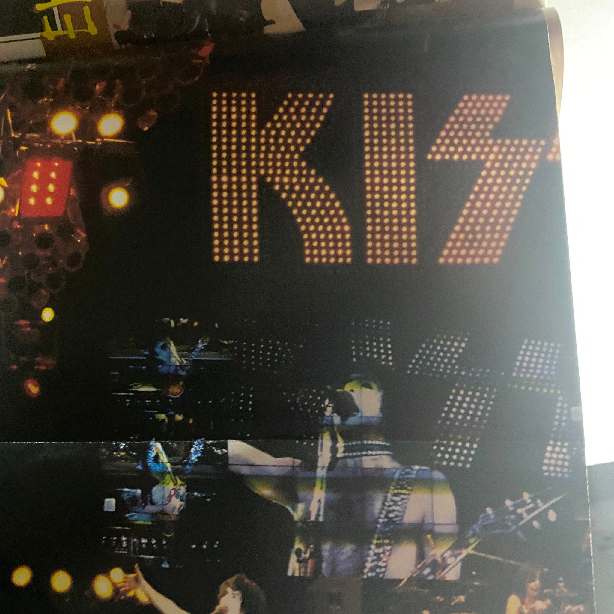 Dynamic live performance image from the Metal Edge Spring 1997 KISS Reunion Tour Magazine, highlighting the KISS logo and band members on stage.