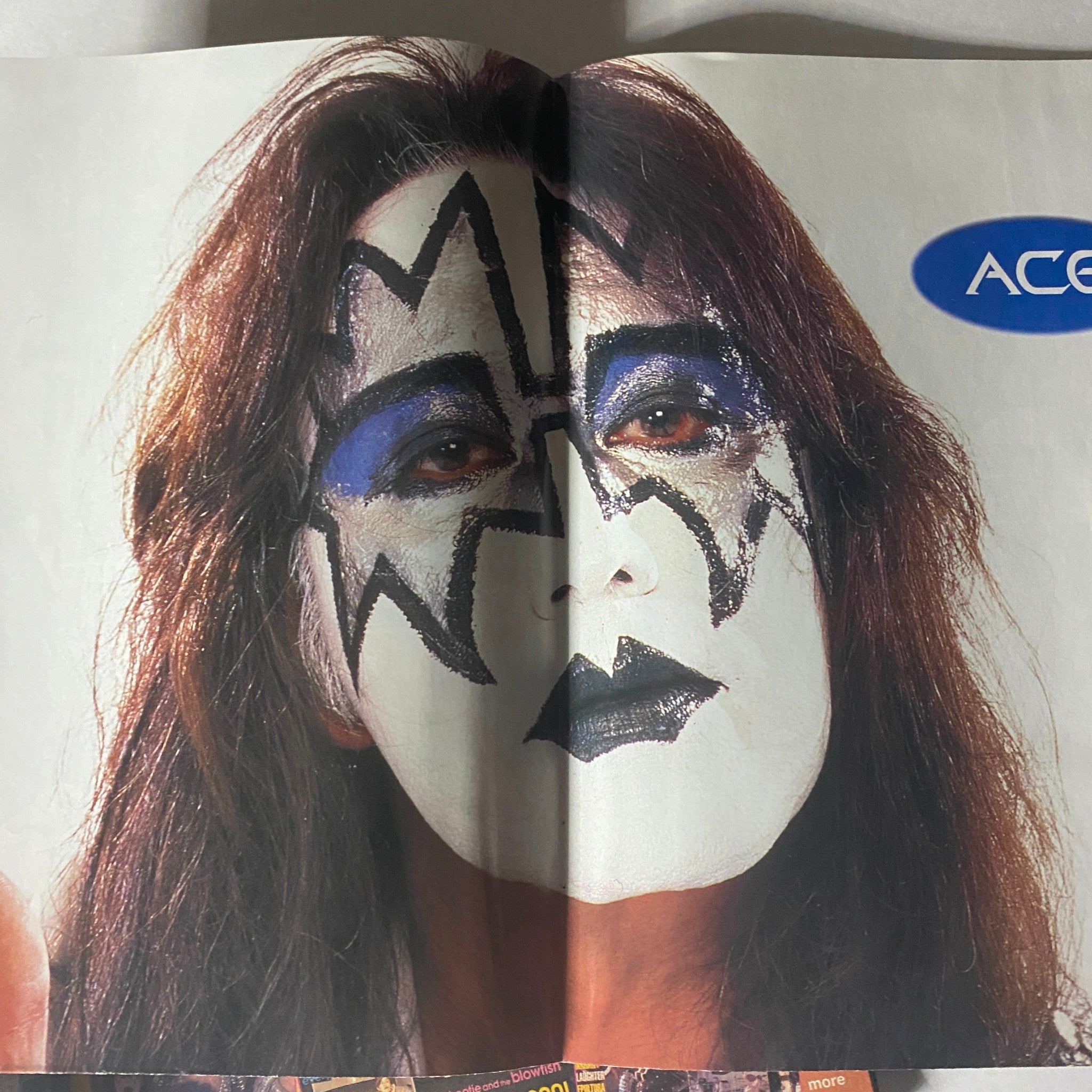 Portrait of a KISS member with iconic makeup and costume, featured in the Metal Edge Spring 1997 KISS Reunion Tour Magazine.