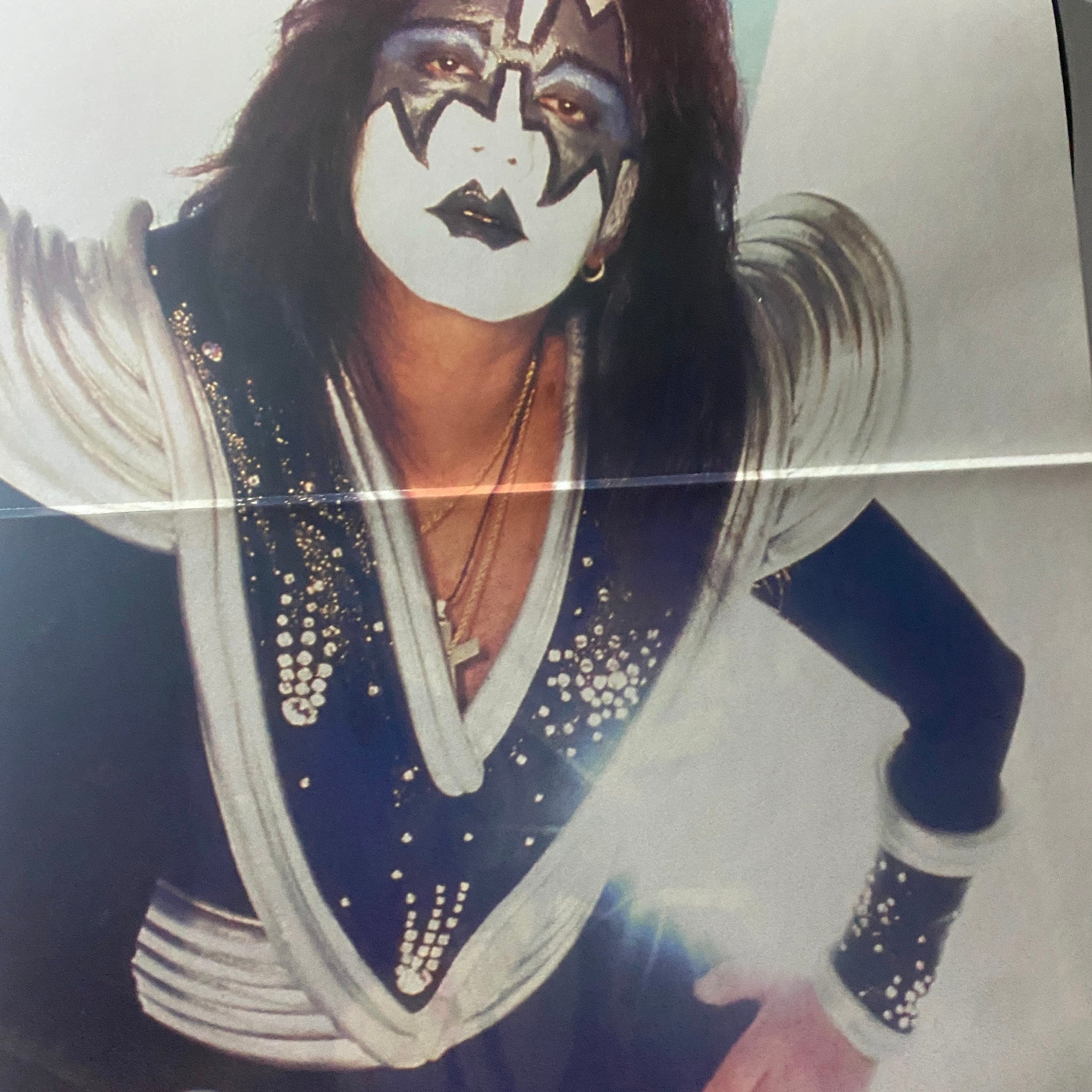 A stunning photo of KISS member in costume from the Official KISS Magazine 1999 Issue #2, capturing the essence of the band's theatrical style.