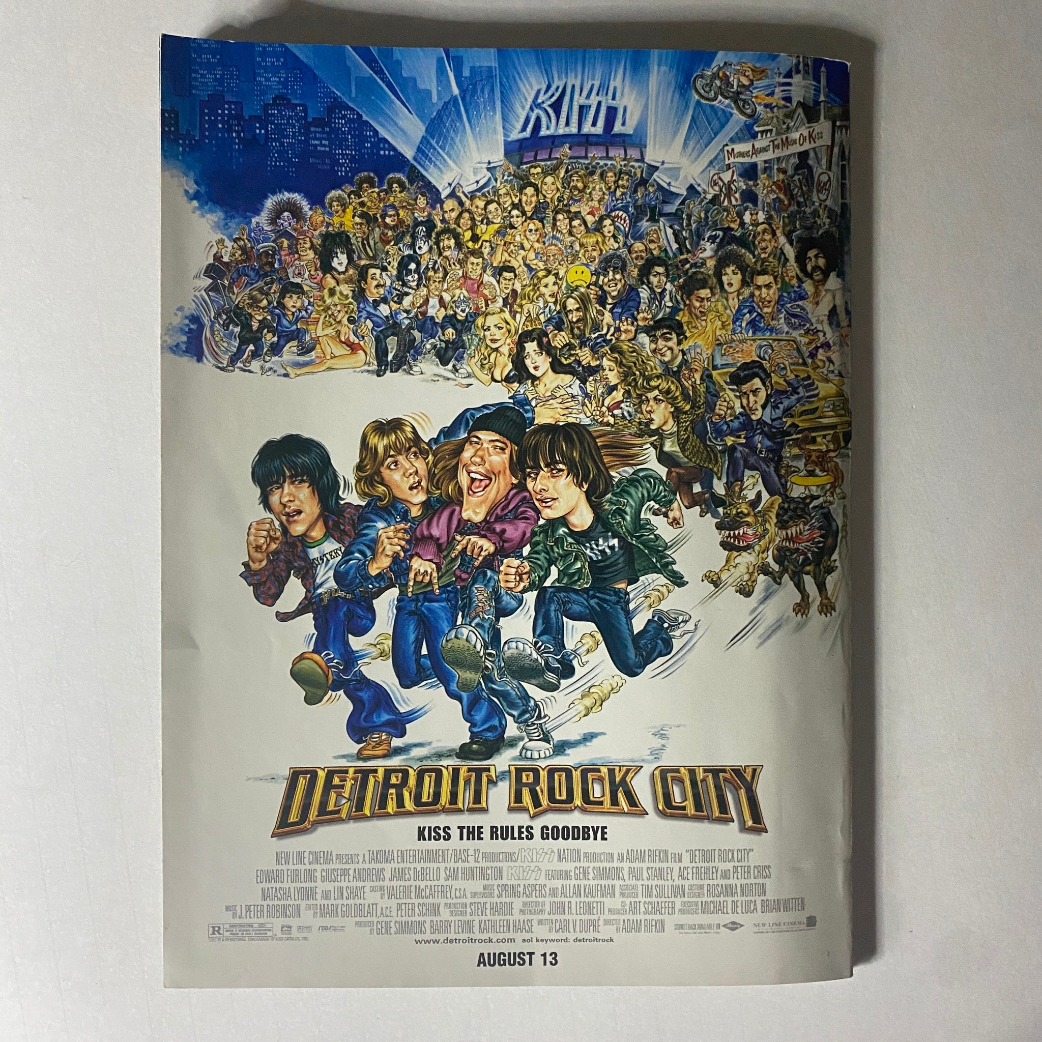 Official KISS Magazine 1999 Issue #2 featuring a vibrant illustration from Detroit Rock City, showcasing KISS and other characters with a colorful backdrop and event details.