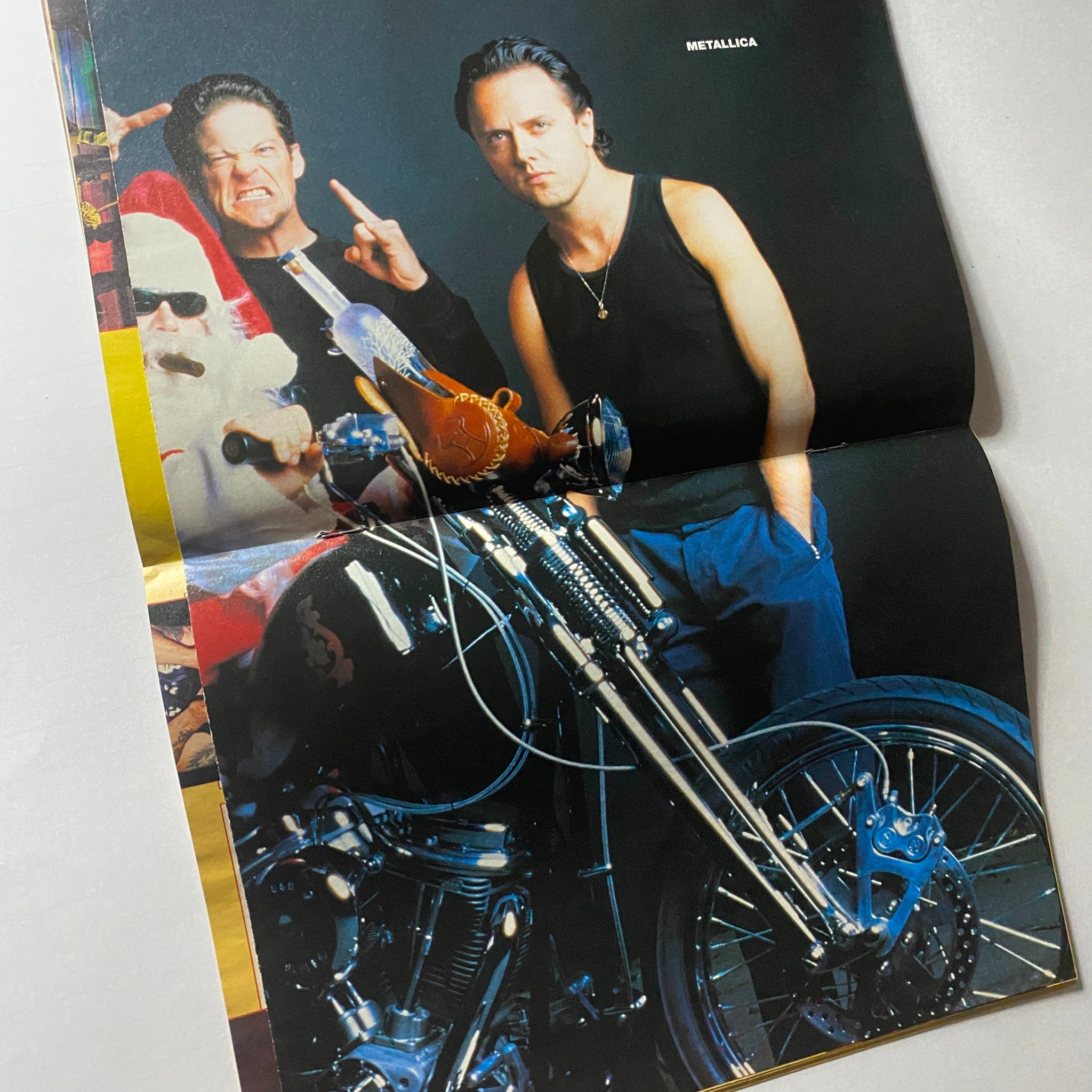 Inside spread from the March 1999 issue of Metal Edge Magazine showcasing Metallica members posing with a vintage motorcycle and Santa Claus, reflecting the magazine's celebration of rock culture.
