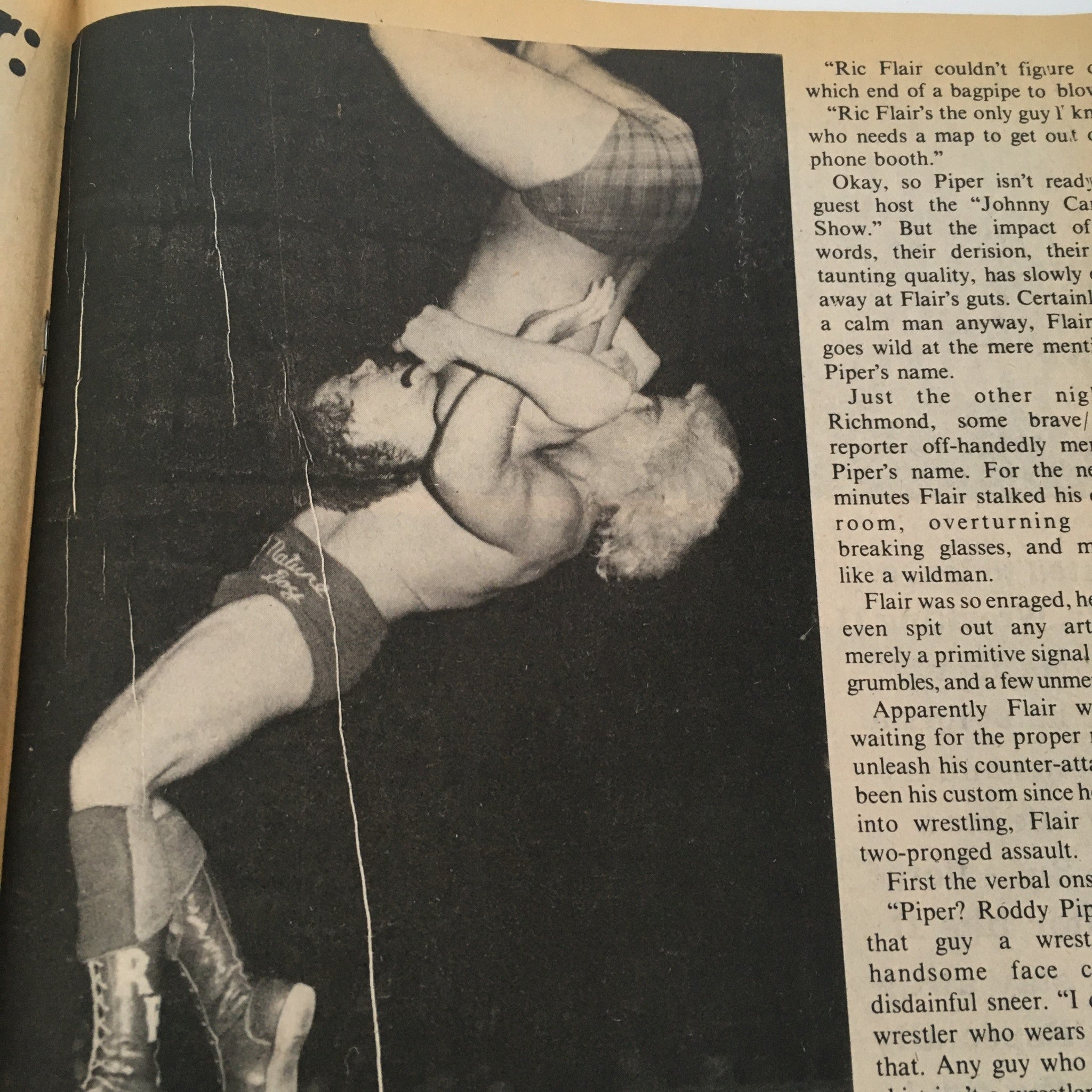 Dynamic photo of Ric Flair versus Roddy Piper showcasing their fierce rivalry, from The Wrestler Magazine April 1981: Ric Flair vs Roddy Piper - The Feud.