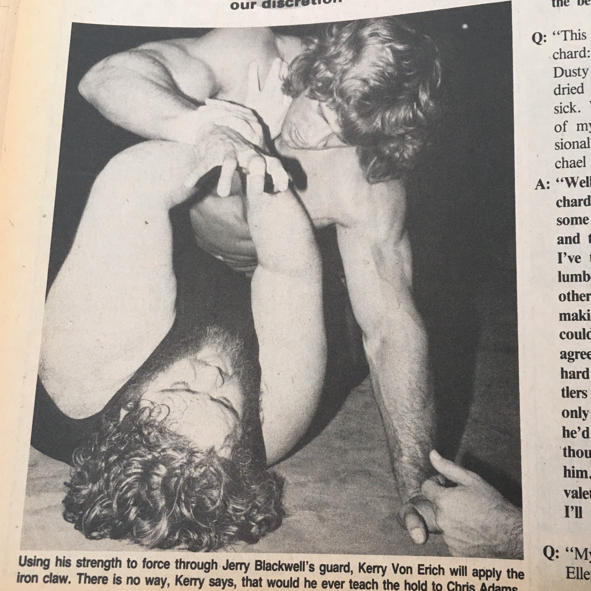 Wrestling action shot from The Wrestler Magazine July 1985, featuring Kerry Von Erich applying an iron claw hold during a match.