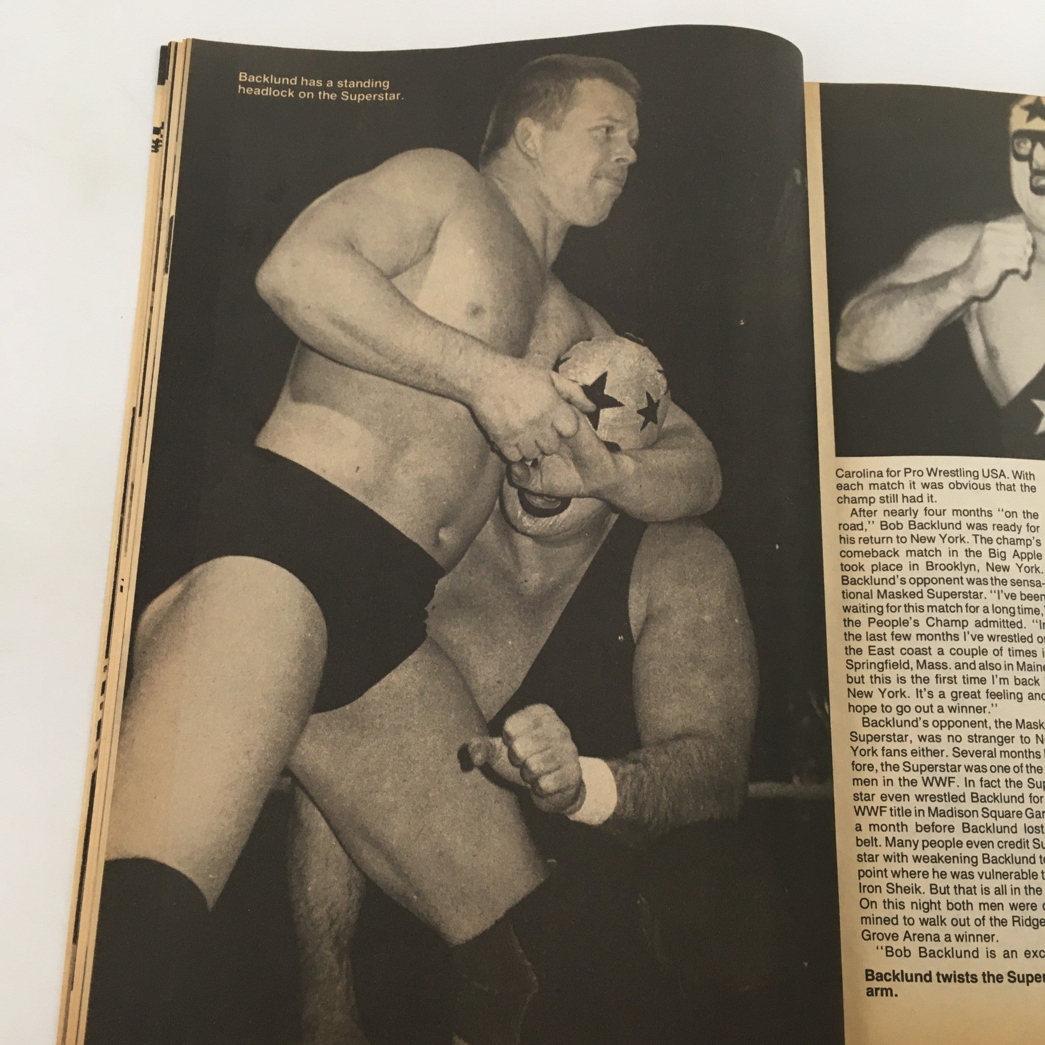 Wrestling Scene Magazine #22 May 1985 highlights wrestler Bob Backlund performing a standing headlock on his opponent, capturing the competitive spirit and physicality of wrestling in the ring.