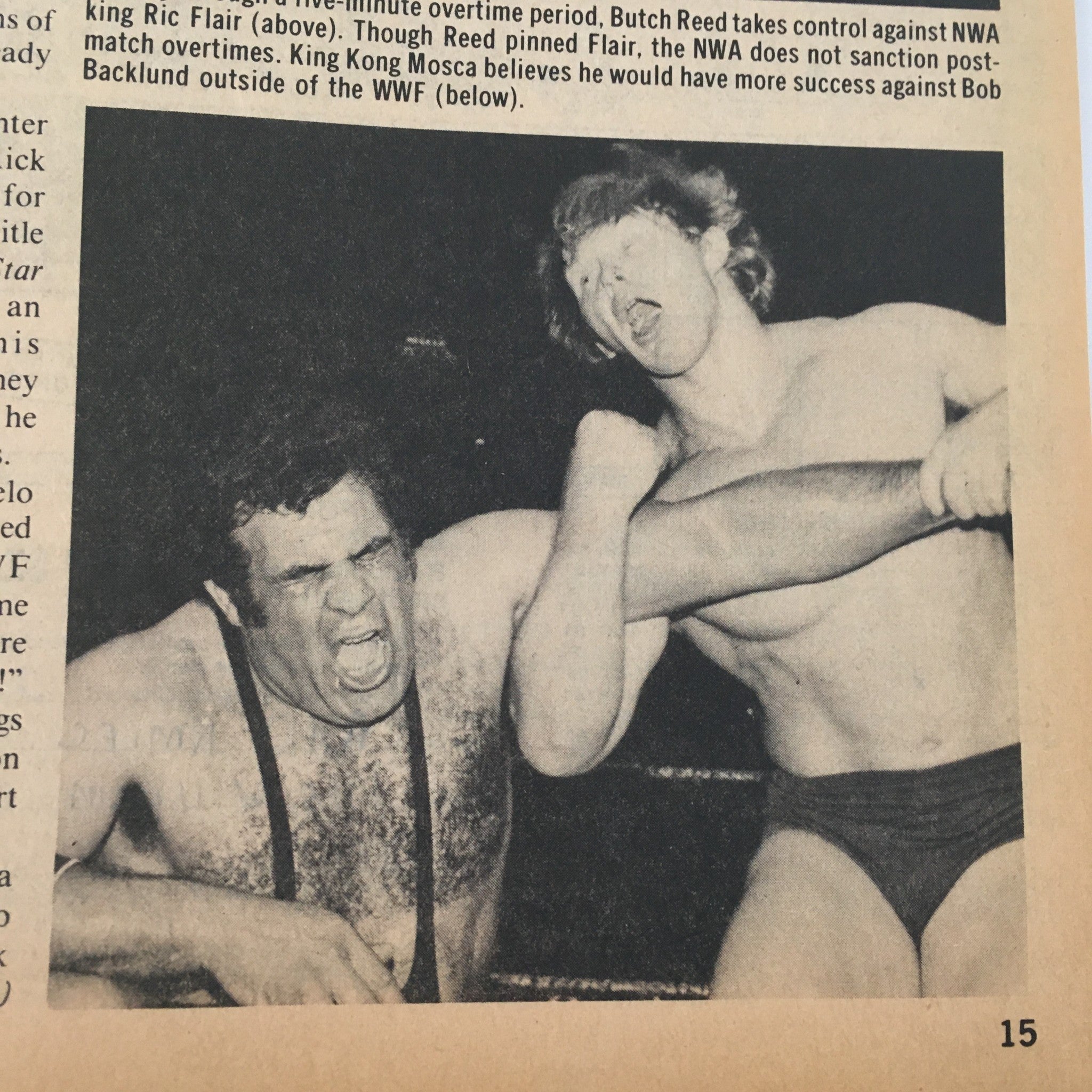 Action shot from The Wrestler Magazine July 1982 featuring Butch Reed wrestling against Ric Flair, illustrating the competitive nature of wrestling during the era.