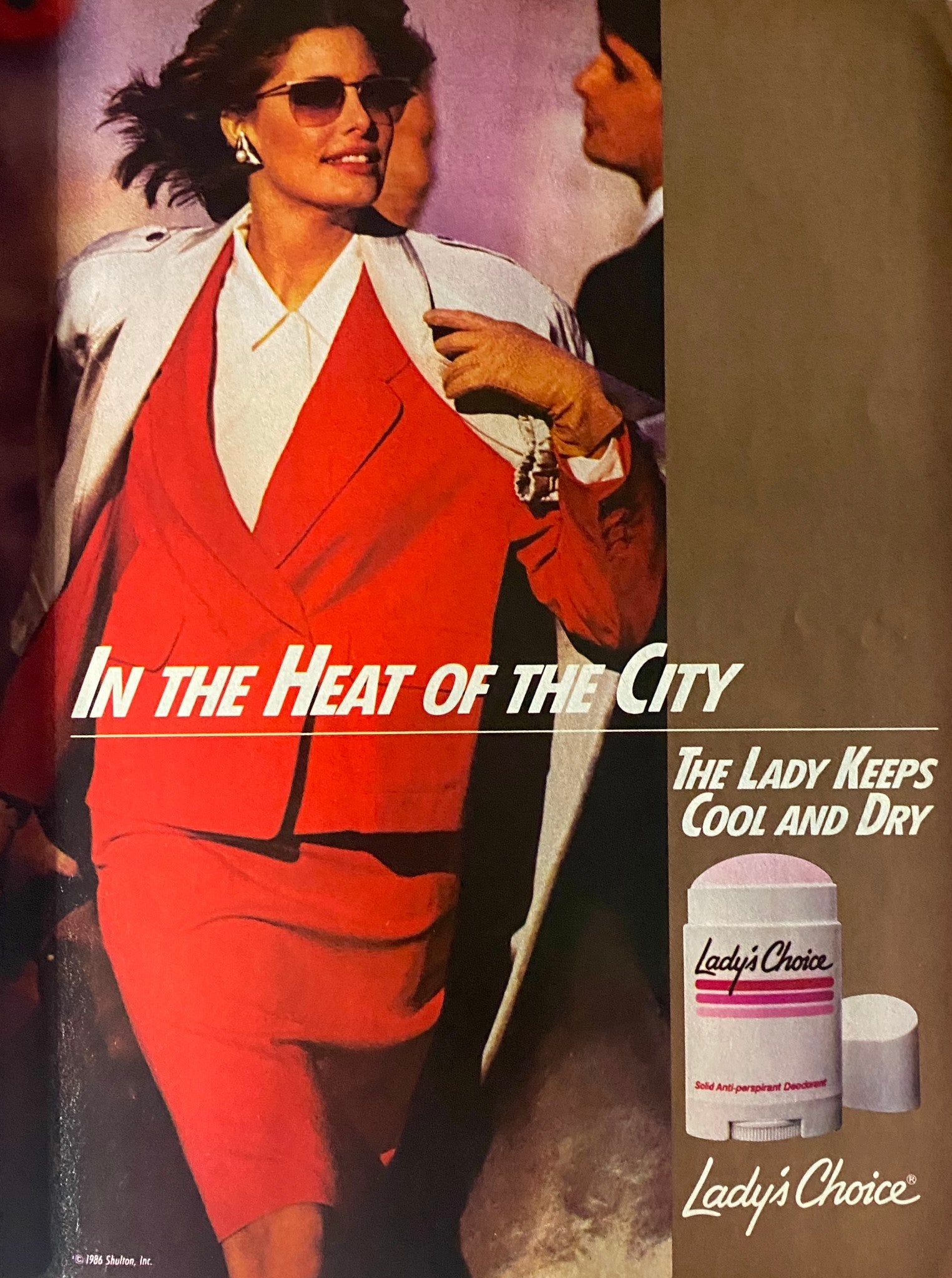 Advertisement in Savvy Magazine June 1986 for Lady's Choice deodorant featuring a stylish woman dressed in red in a busy city setting.