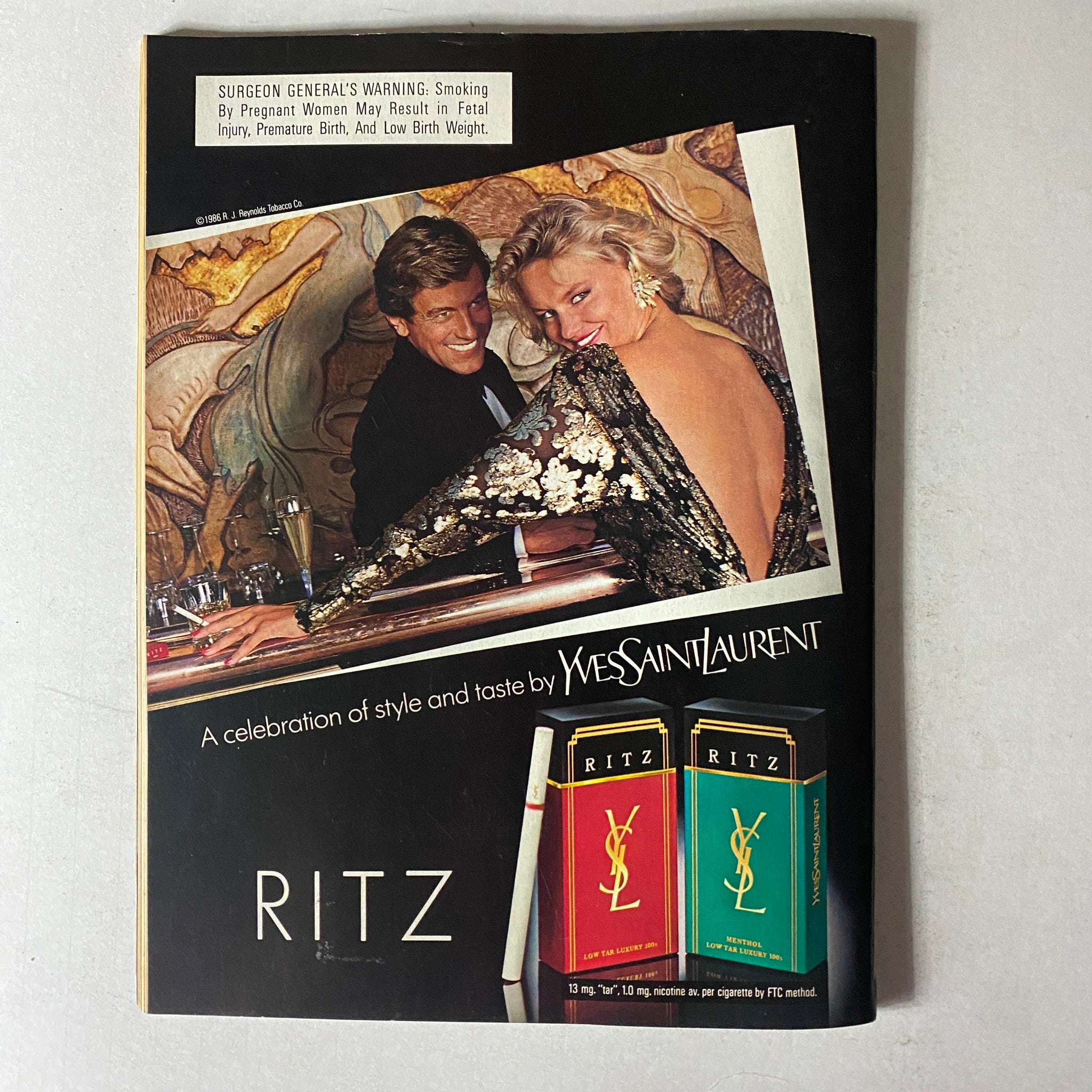 Advertisement in Savvy Magazine June 1986 promoting Ritz cigarettes featuring a glamorous couple at an upscale venue, emphasizing luxury and style.