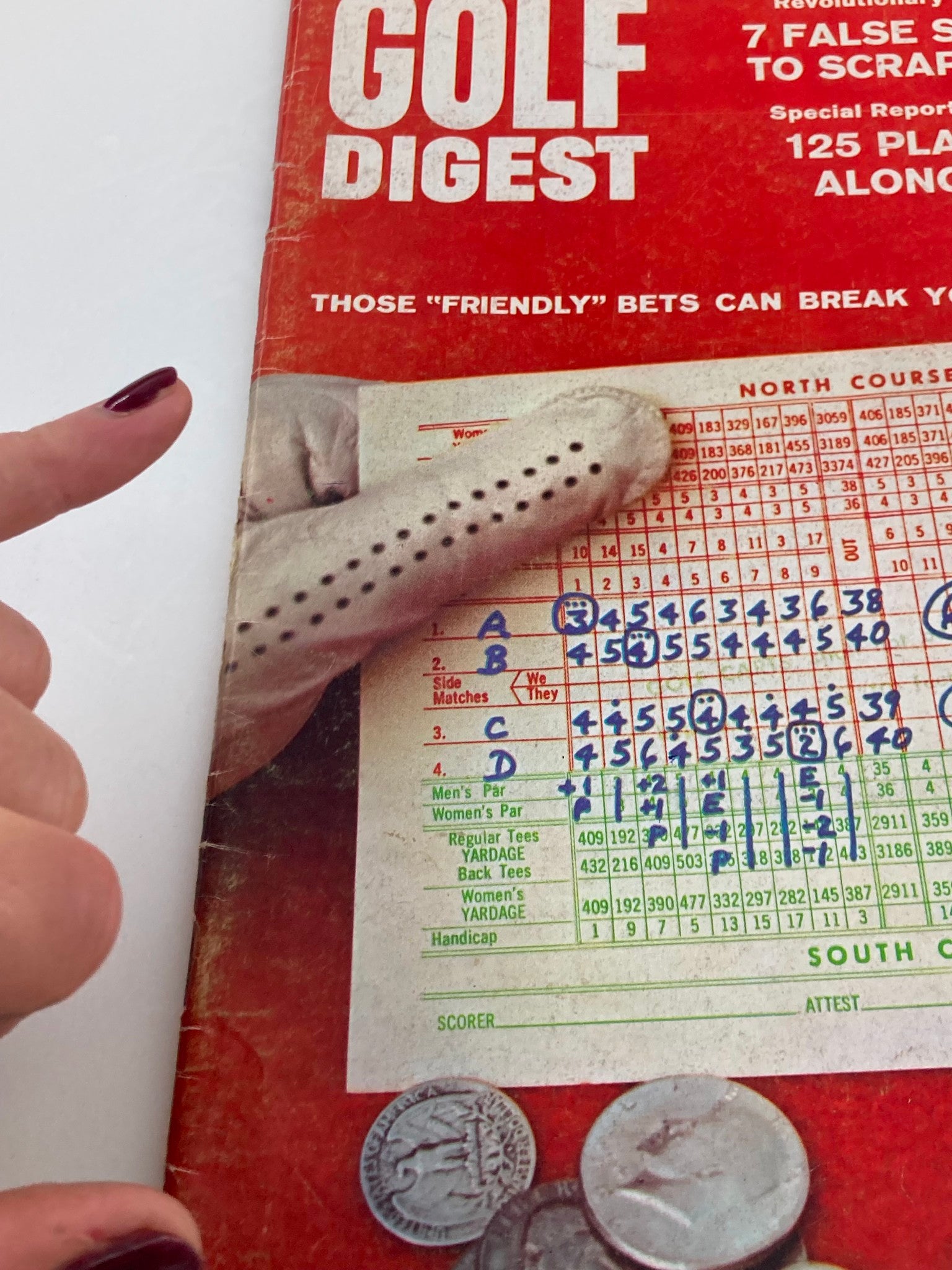 Close-up of Golf Digest Magazine November 1967 cover showing a golf scorecard and a hand pointing at the betting information.