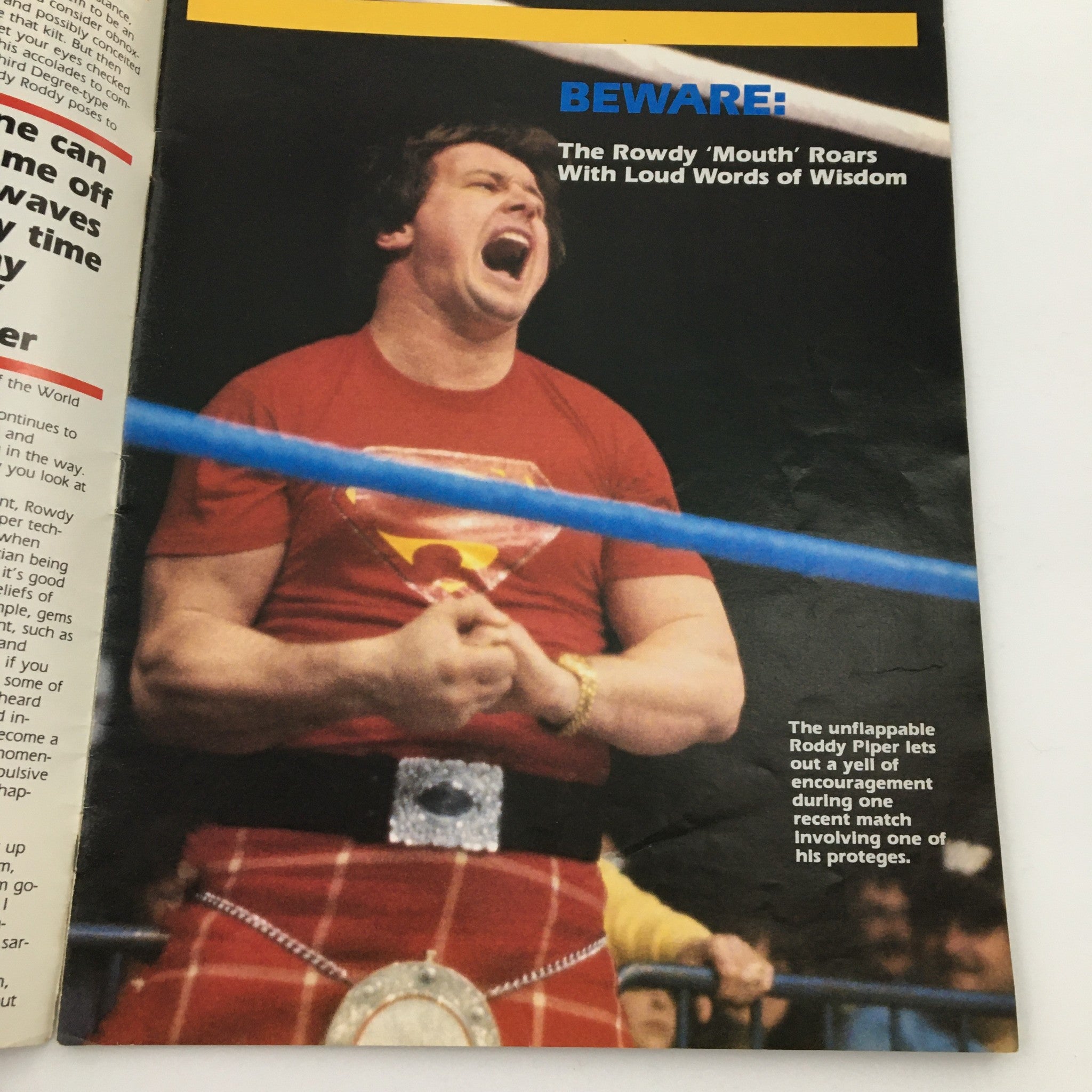 An inside page of WWF Program 1984 featuring Rowdy Roddy Piper in the wrestling ring, wearing a red superhero-themed shirt and a kilt.