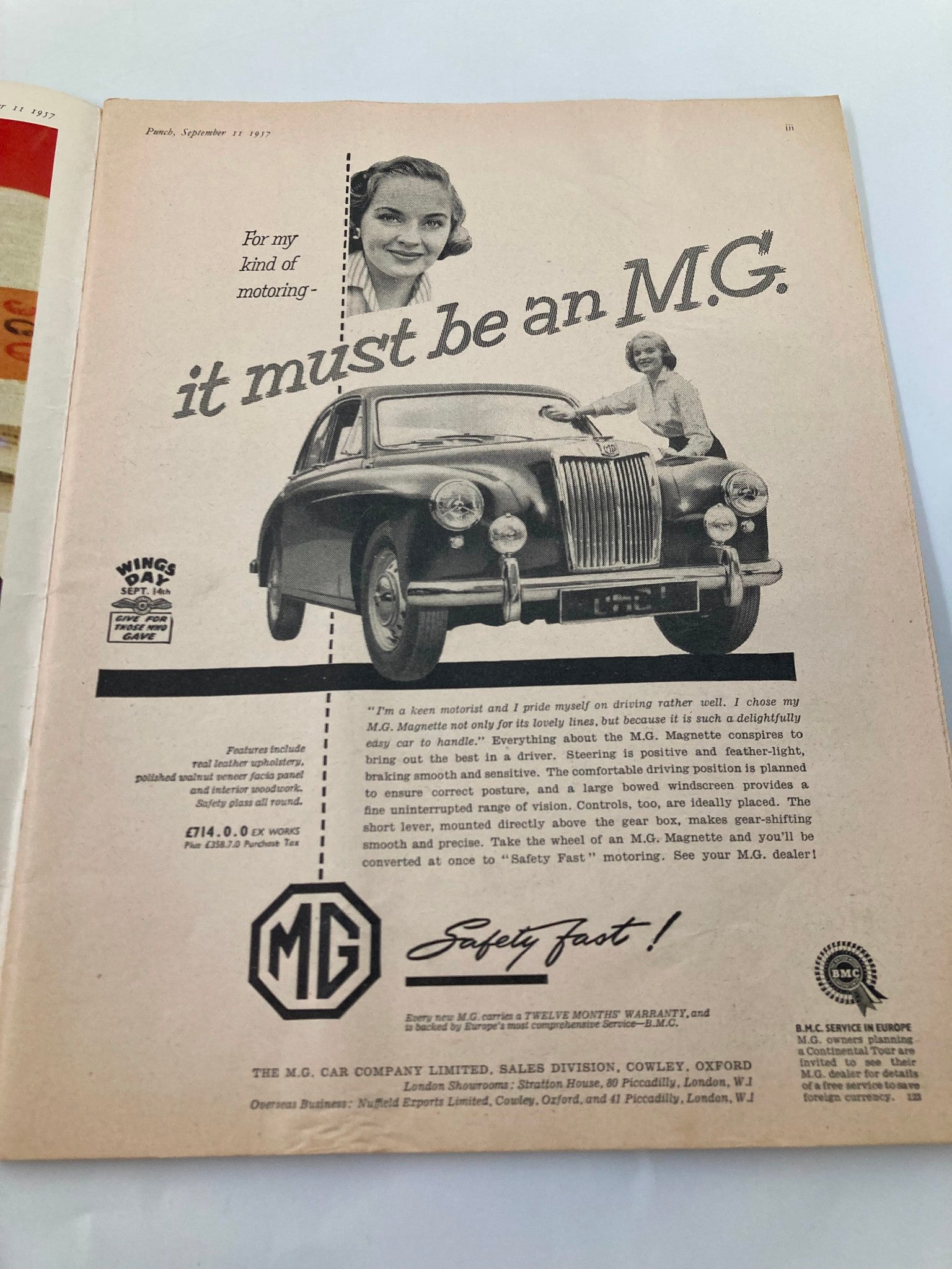 Vintage advertisement from the VTG Punch Magazine September 11 1957 featuring a woman promoting the MG car, illustrating mid-century automotive marketing.