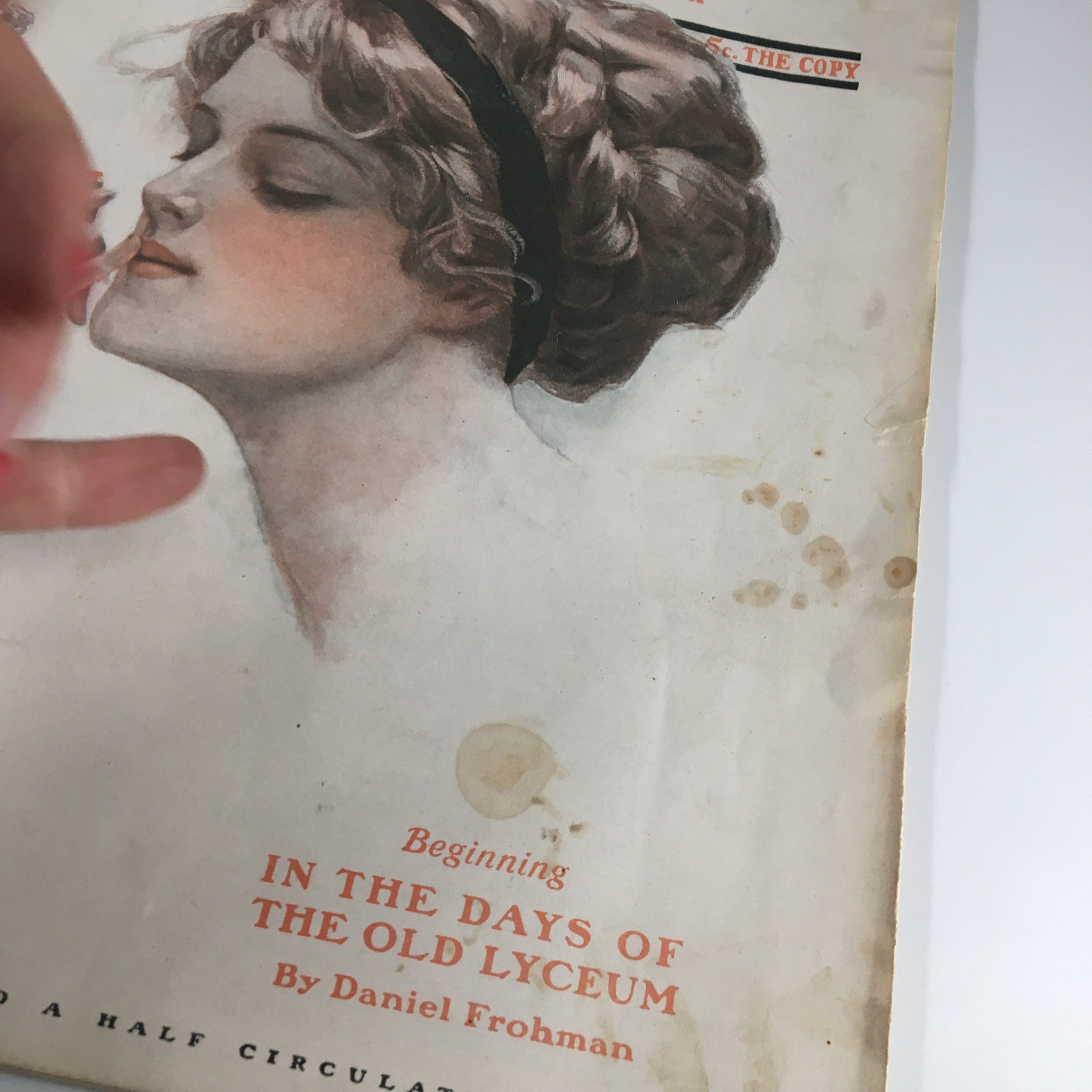 Close-up of The Saturday Evening Post cover from October 22, 1910, highlighting the title 'In The Days of The Old Lyceum' by Daniel Frohman, featuring a woman's profile and artistic details.