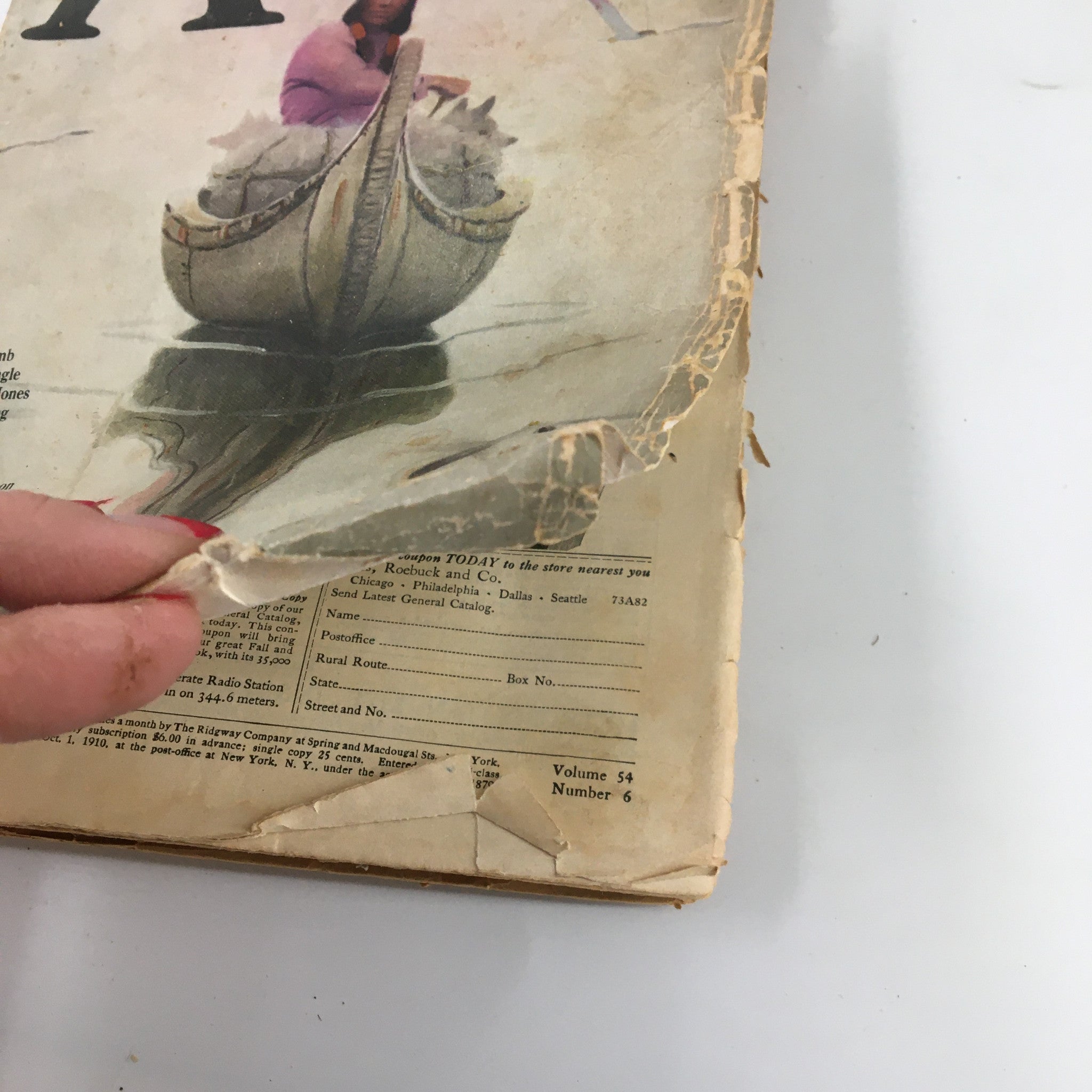 Close-up of the cover damage on VTG Adventure Magazine September 30 1925, showing torn edges and creases, highlighting its vintage condition as a collectible item.