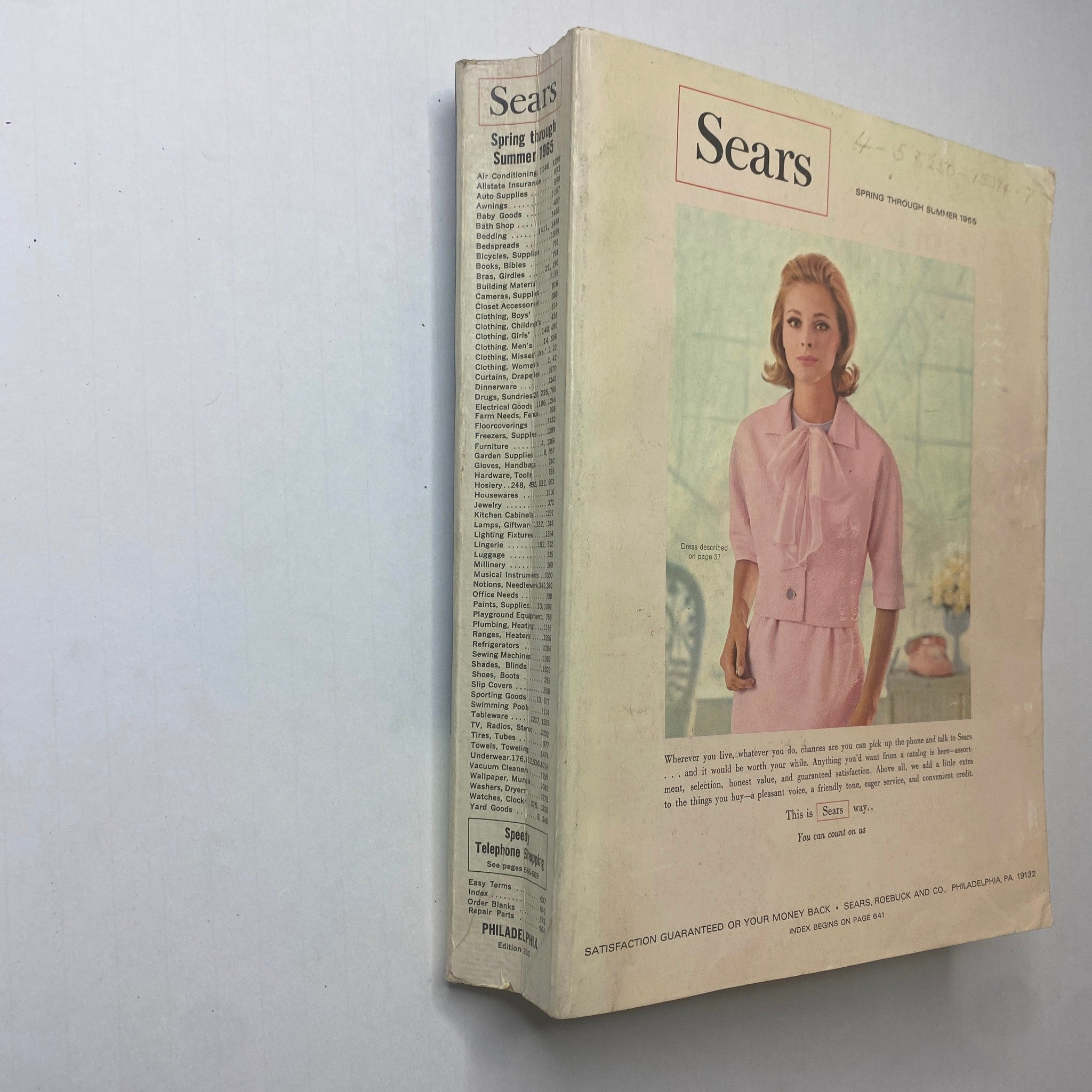 1965 Sears Spring and Summer Catalog showcasing the cover design with a model in a pink outfit, embodying mid-20th century fashion trends.