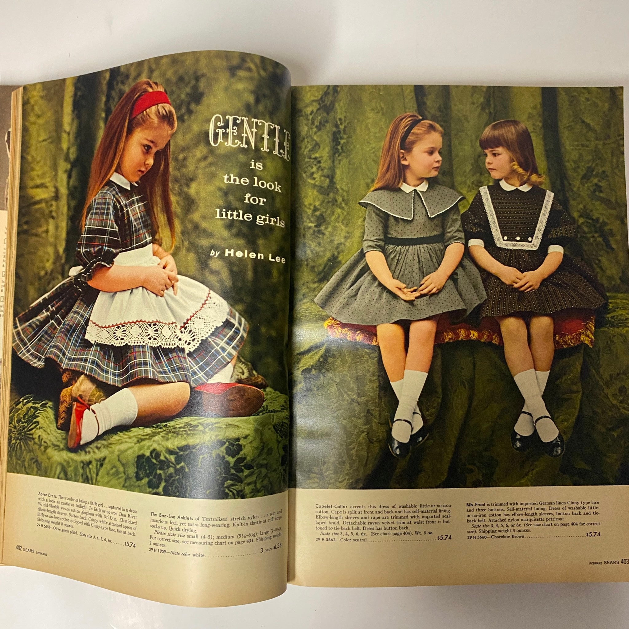 1960 Sears Fall and Winter Catalog showcasing a vintage fashion spread featuring little girls in plaid and grey dresses, highlighting mid-century styles and children's clothing options.