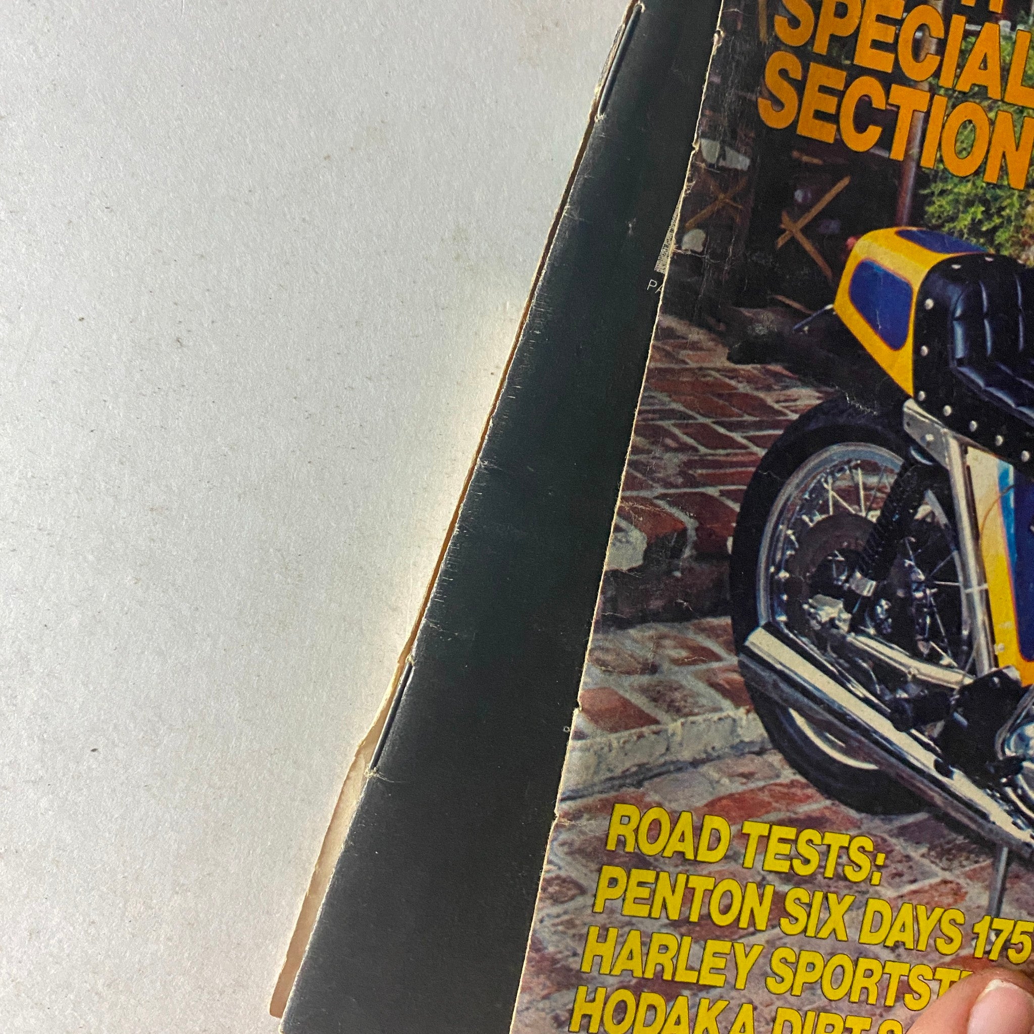 Close-up view of the spine of Motorcyclist Magazine, November 1973, showcasing the title and condition of the publication.