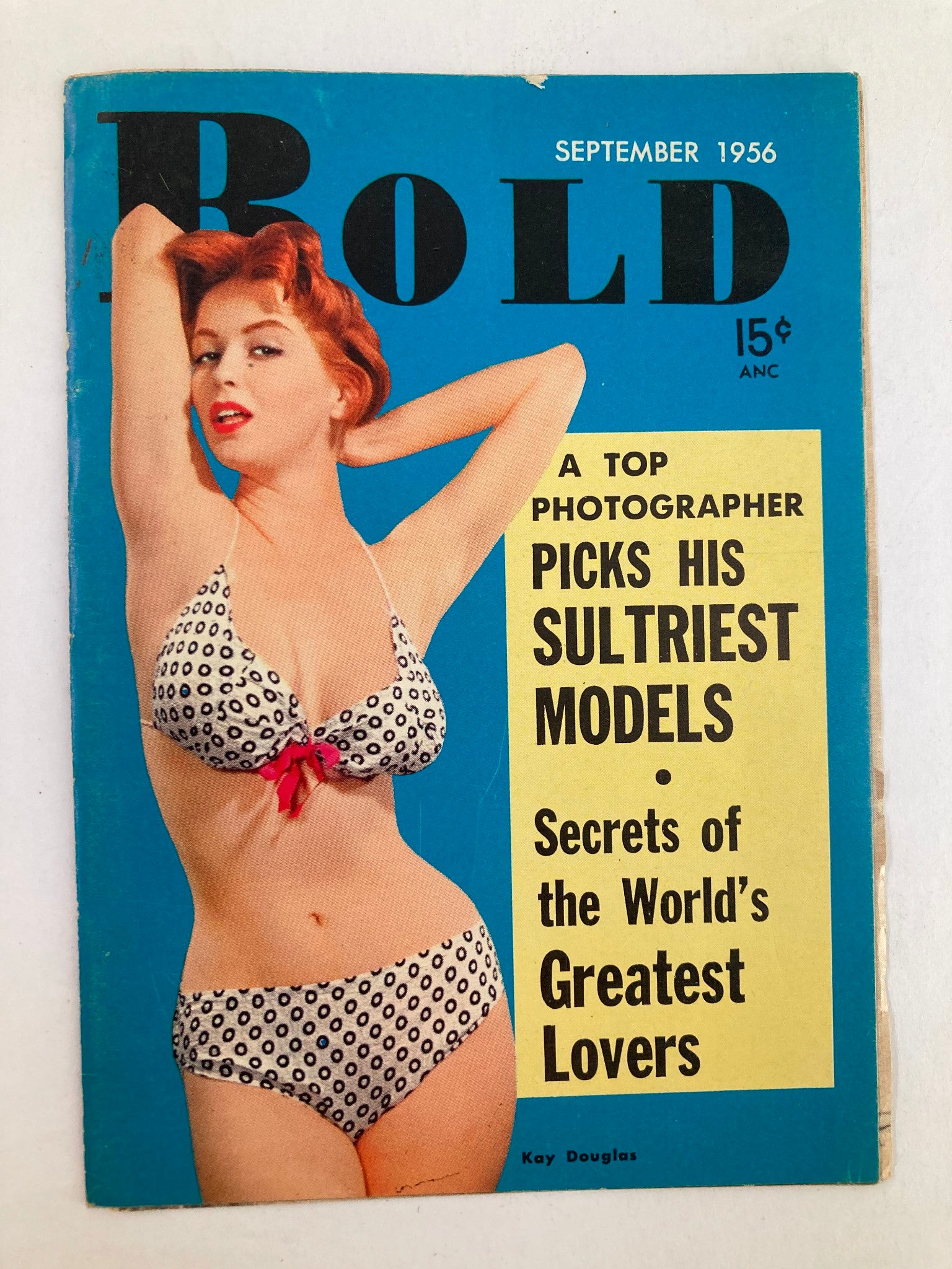 VTG Bold Magazine September 1956 featuring Kay Douglas on the cover, showcasing a retro fashion design with a model in a polka dot bikini and introducing photography tips for selecting sultriest models.