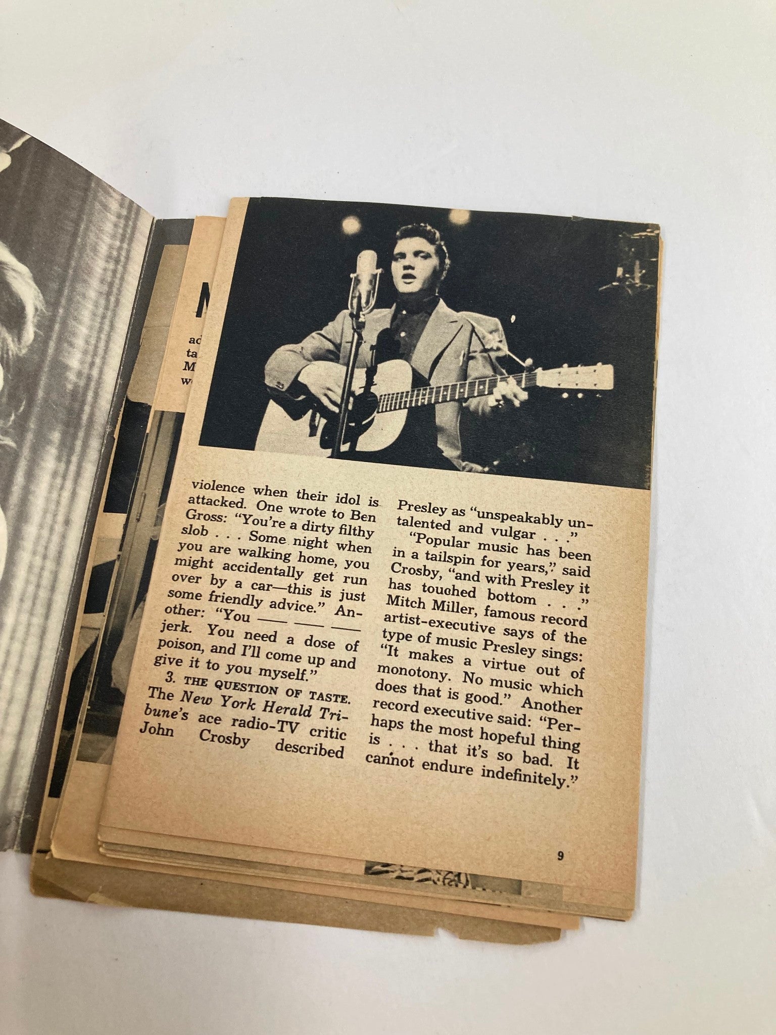 Interior page of Show Magazine from September 1955 displaying a black and white image of Elvis Presley performing with a guitar. The text discusses public perceptions of Presley and his influence during the rise of rock and roll.