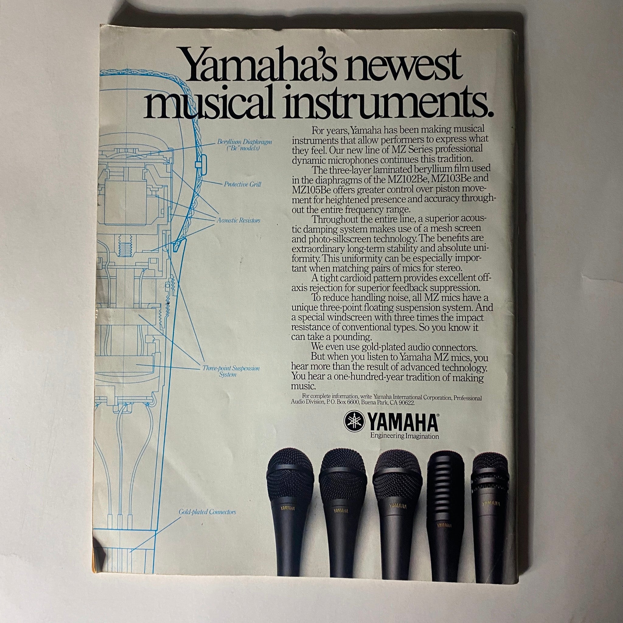 Vintage Musician Magazine August 1987 featuring an advertisement for Yamaha's newest musical instruments, showcasing a detailed microphone design and technical specifications.