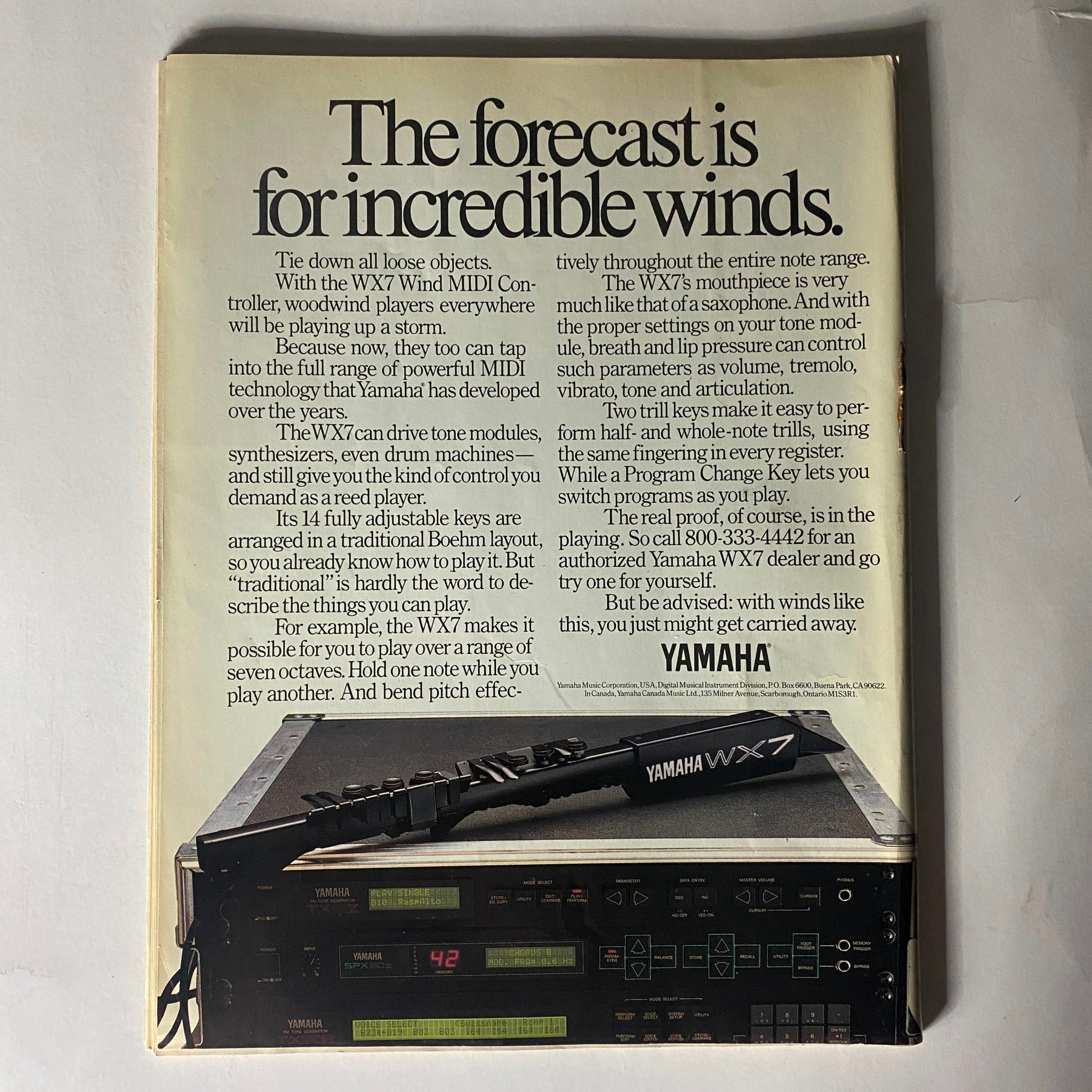 Vintage advertisement for the Yamaha WX7 Wind MIDI Controller from Musician Magazine December 1988 featuring text about its features like adjustable keys and control for synthesizers, with an illustration of the WX7 and MIDI modules.