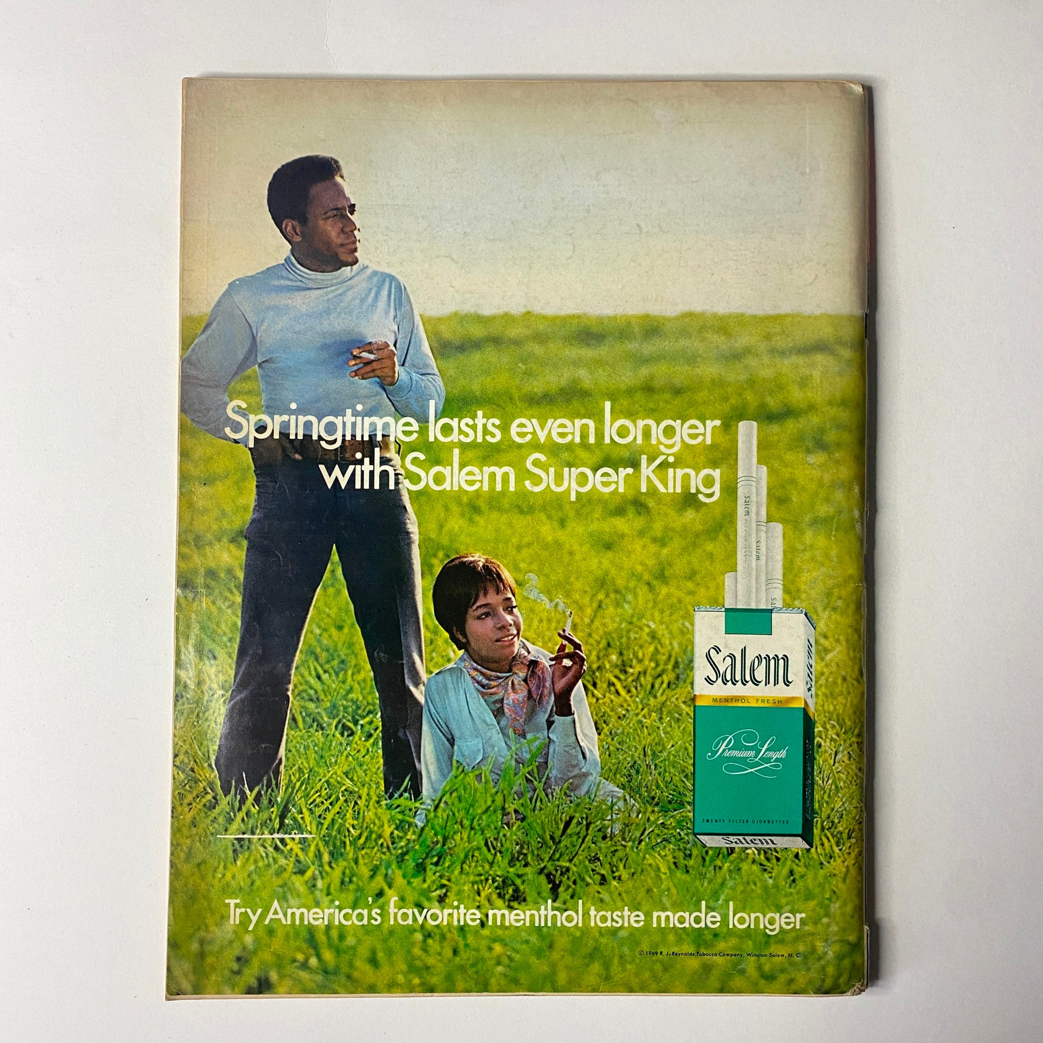 Advertising page from the August 1970 Ebony Magazine promoting Salem Super King cigarettes, with a promotional image of a couple in a grassy field, part of the Black America Special Issue.