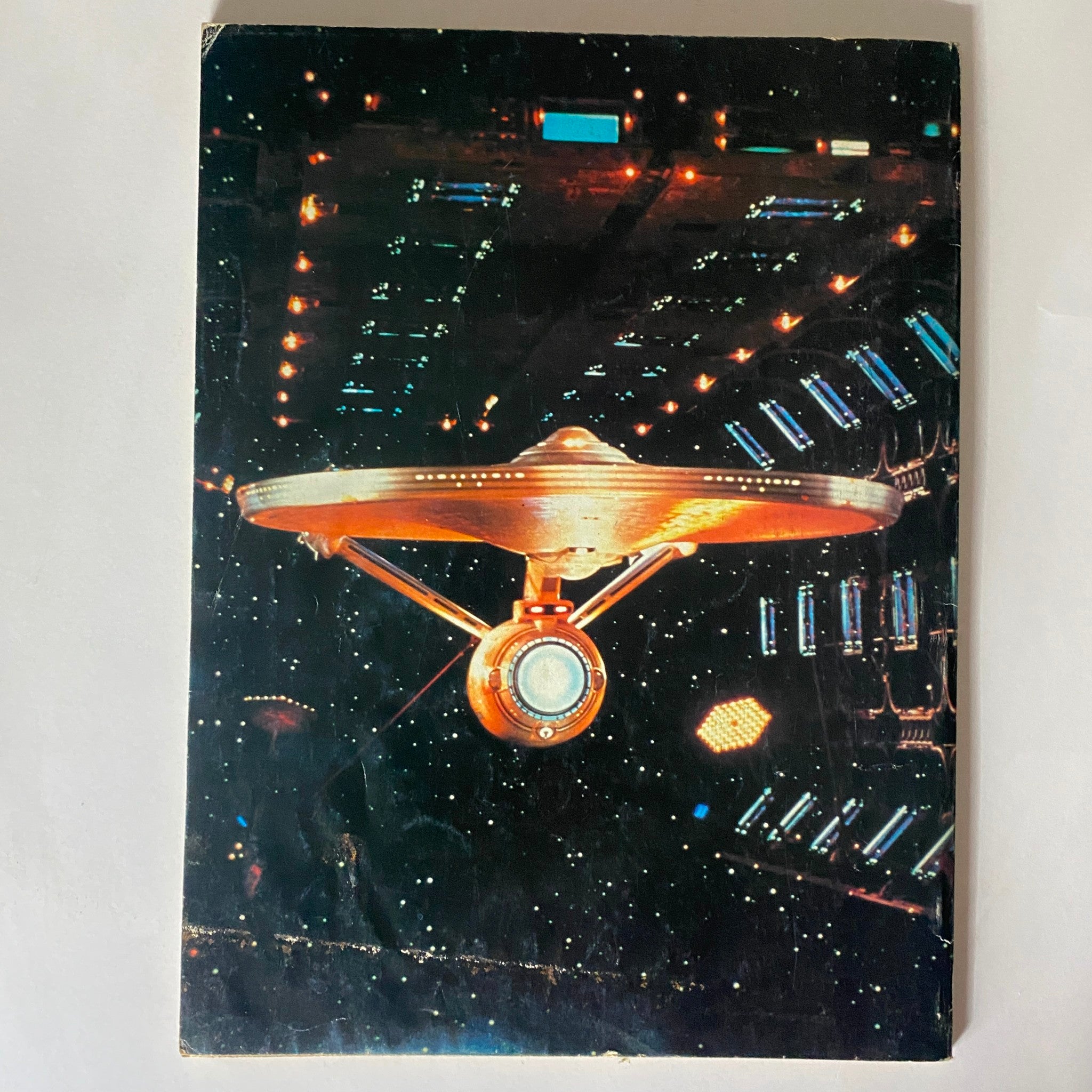 Back cover of The Best of Starlog Magazine 1980 Vol. 1, featuring an illustration of the Starship Enterprise in space.