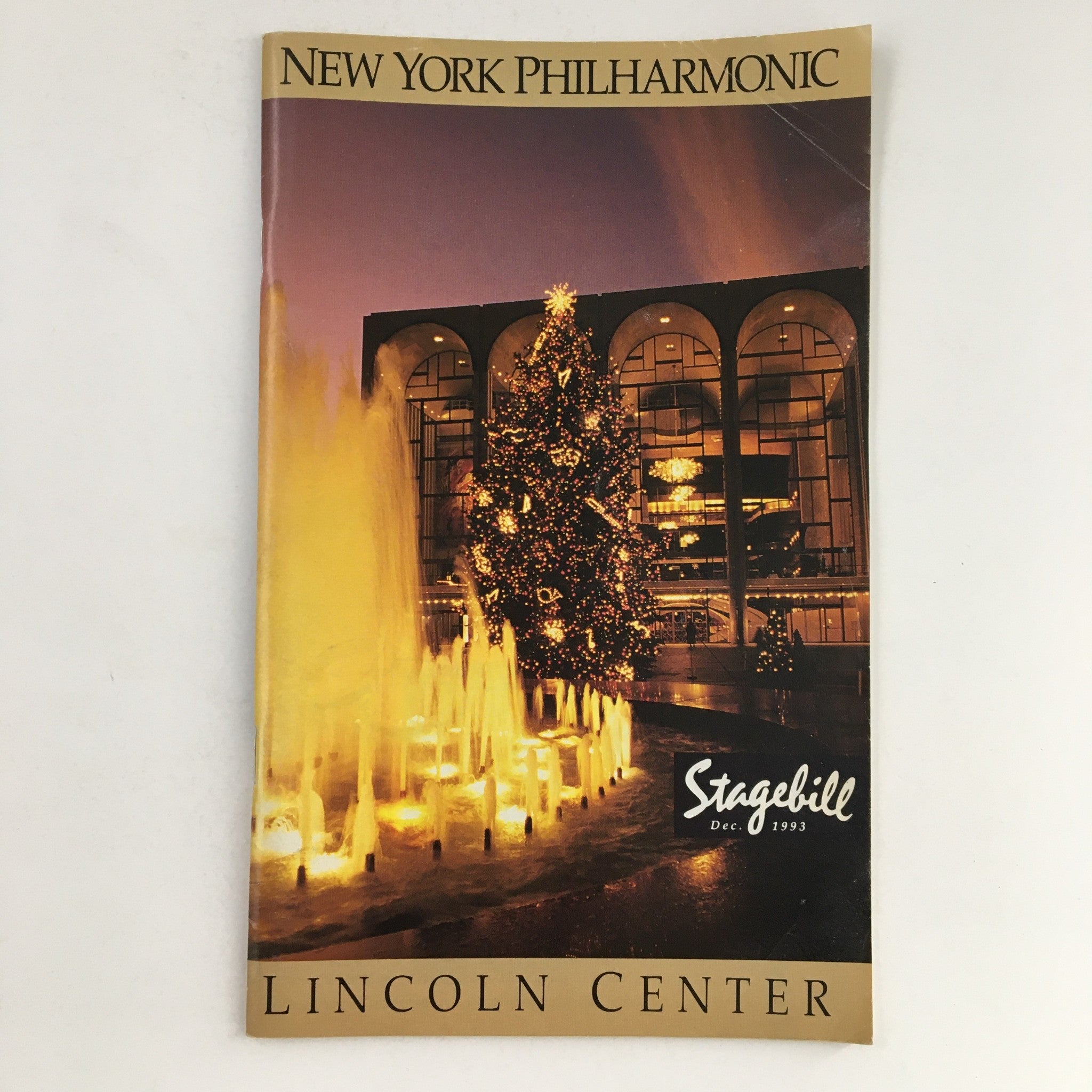 Cover of the 1993 Stagebill for New York Philharmonic & Lincoln Center Present Tux Redux, featuring a decorated Christmas tree and fountain display.