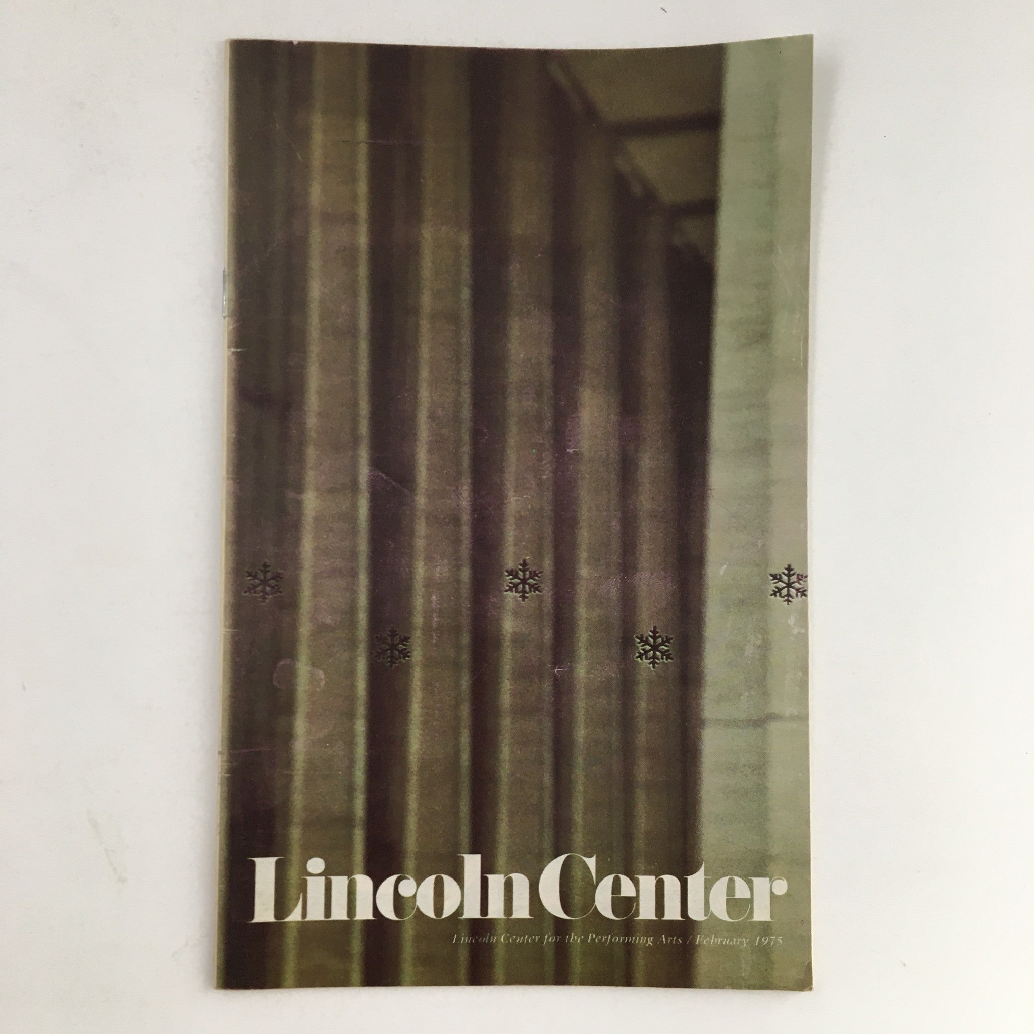 Cover of the 1975 Stagebill from Lincoln Center for the Performing Arts featuring a minimalist design and the title 'Lincoln Center' in bold typography. This issue presents Frank Schubert.