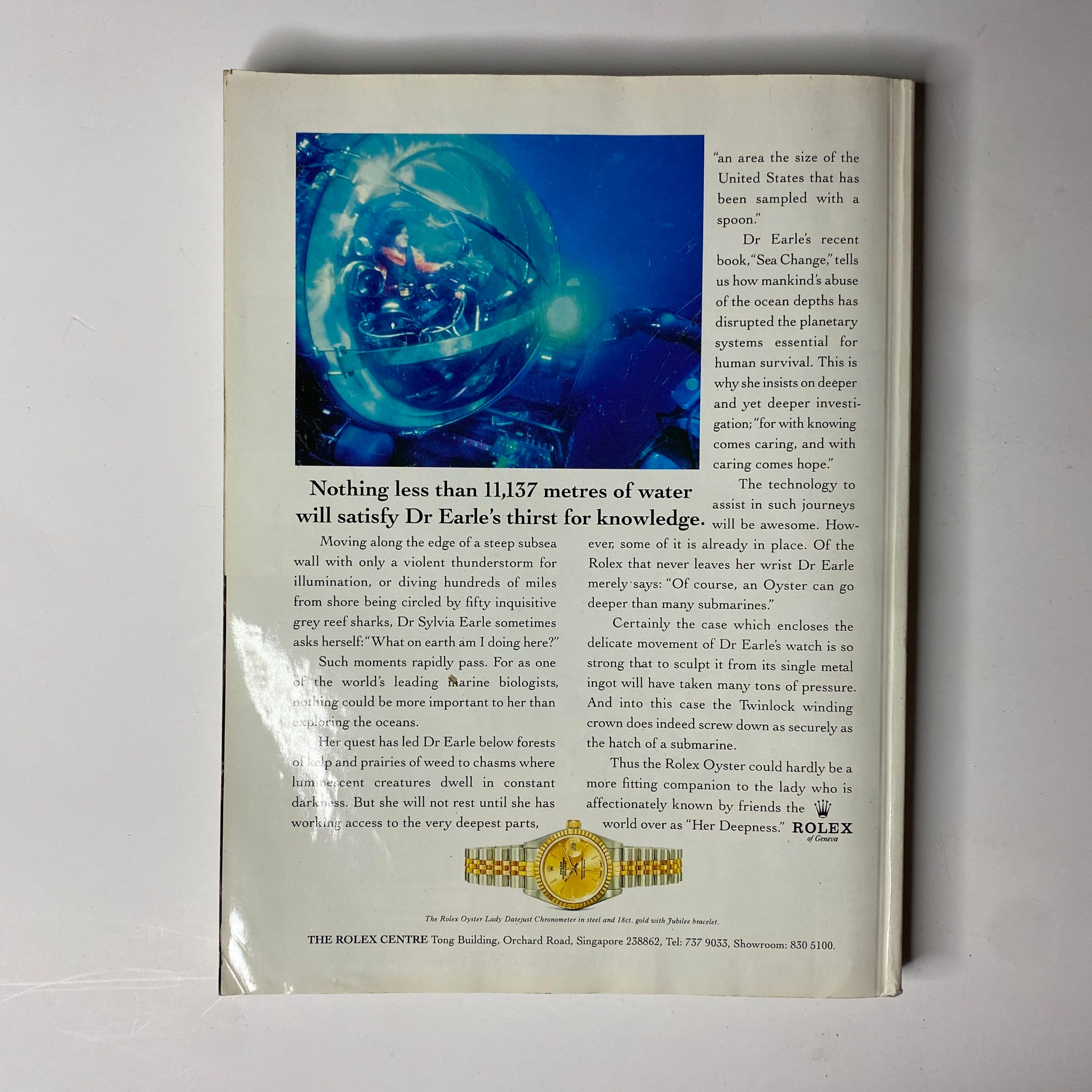 Back cover of Her World Magazine December 1997 displaying an advertisement for Rolex watches with an underwater theme.