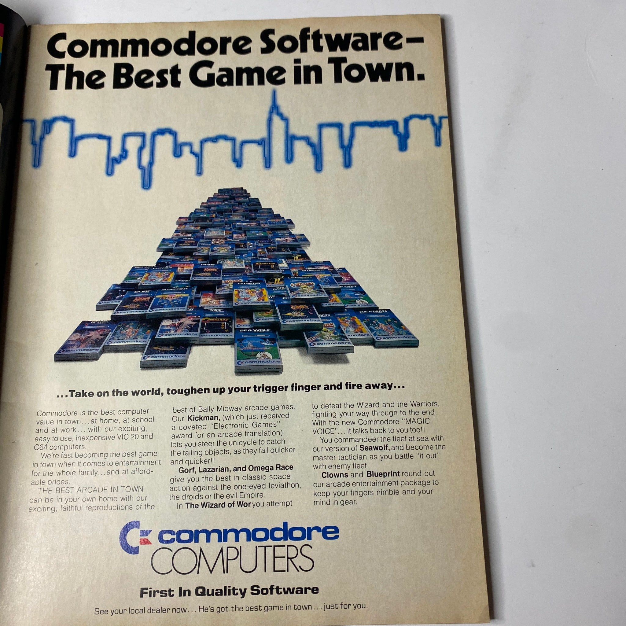 Advertisement for Commodore Software in Electronic Games Magazine January 1984, promoting the quality of Commodore games with a visual of several software boxes displayed in a pyramid formation.