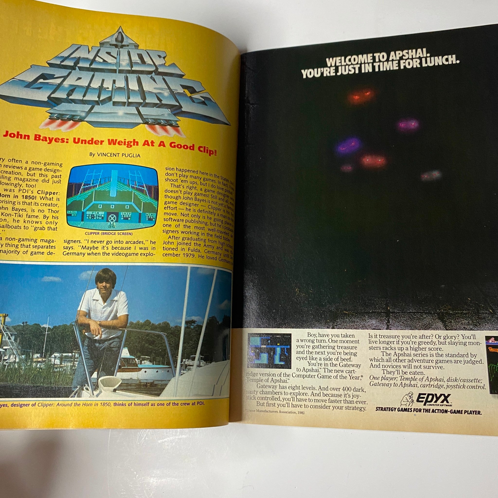 Article spread from Electronic Games Magazine December 1983 highlighting gaming news with an advertisement welcoming readers to 'Apshal'.