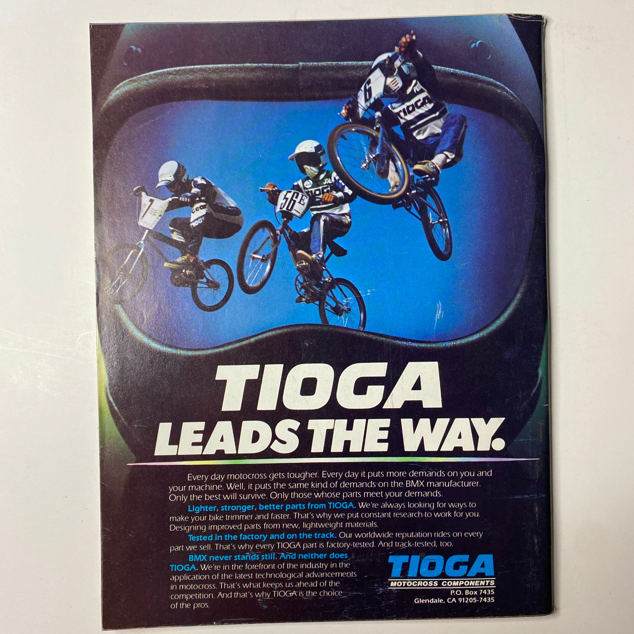 BMX Action Magazine November 1983 R. L. Osborn Cover displaying an advertisement for Tioga, highlighting their BMX products with a striking image of riders in action. A testament to BMX innovation and performance.